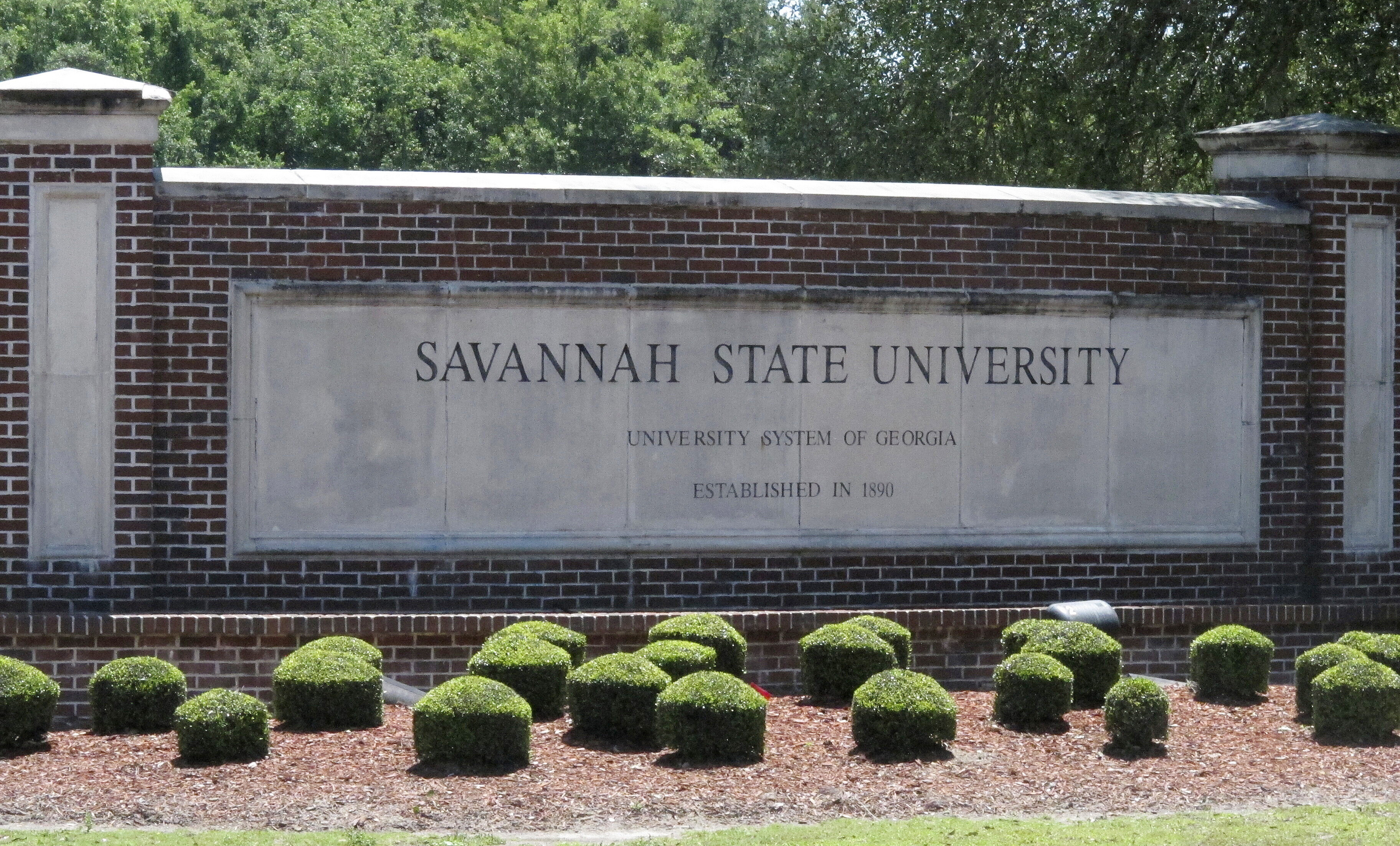 FILE - The school plaque sits at the main entrance to Savannah State University in Savannah, Ga. The average historically Black college and university received 178 times less funding from foundations than the average Ivy League school in 2019, according to a new report on the underfunding of HBCUs released Tuesday, May 2, 2023. (AP Photo/Russ Bynum, File)