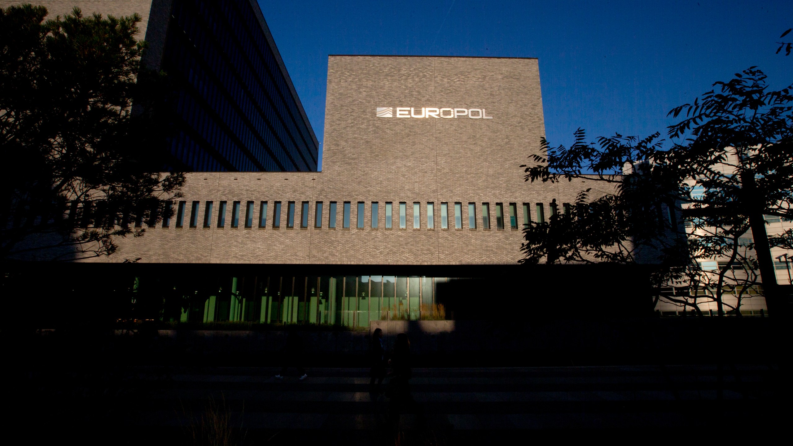 FILE- This Wednesday, Oct. 10, 2018, file photo shows the sun bouncing off the Europol headquarters in The Hague, Netherlands. LEuropean Union law enforcement agency Europol says police around the world have seized an online marketplace and arrested nearly 300 people allegedly involved in buying and selling drugs on the dark web. The operation, coordinated by Europol and targeting the “Monopoly Market,” is the latest major takedown of sales platforms for drugs and other illicit goods on the dark web. Europol said Tuesday, May 2, 2023. (AP Photo/Peter Dejong, File)