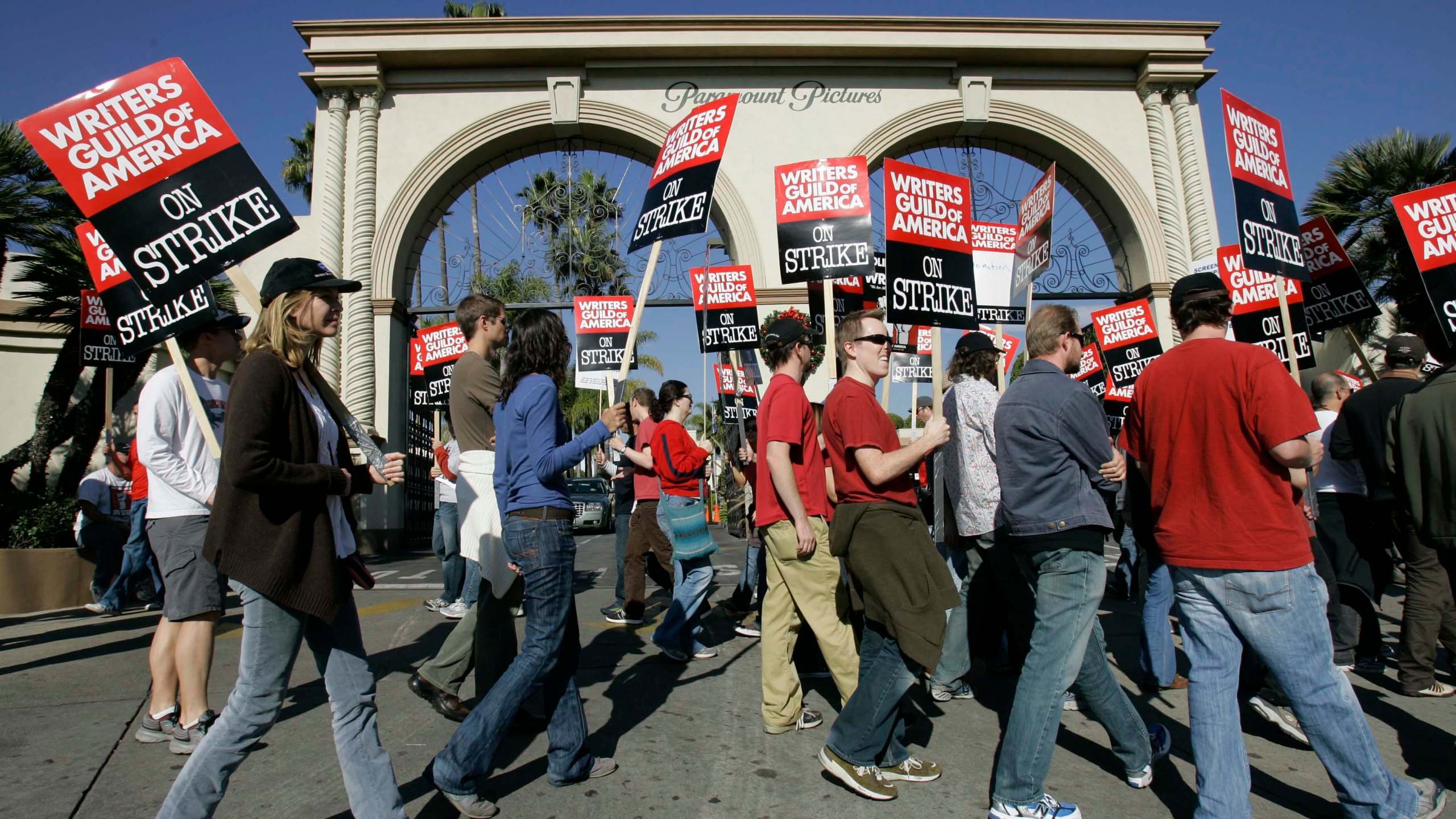 FILE - Striking writers walk the picket line outside Paramount Studios in Los Angeles on Dec. 13, 2007. Television and movie writers on Monday, May 1, 2023, declared that they will launch an industrywide strike for the first time since 2007, as Hollywood girded for a shutdown in a dispute over fair pay in the streaming era. (AP Photo/Nick Ut, File)