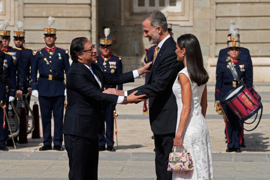 Colombia's President Gustavo Petro, left, and Spain's King Felipe, centre, greet each other alongside Spain's Queen Letizia during a welcome ceremony at the Royal Palace in Madrid, Spain, Wednesday, May 3, 2023. President Petro is on a state visit to Spain. (AP Photo/Paul White)