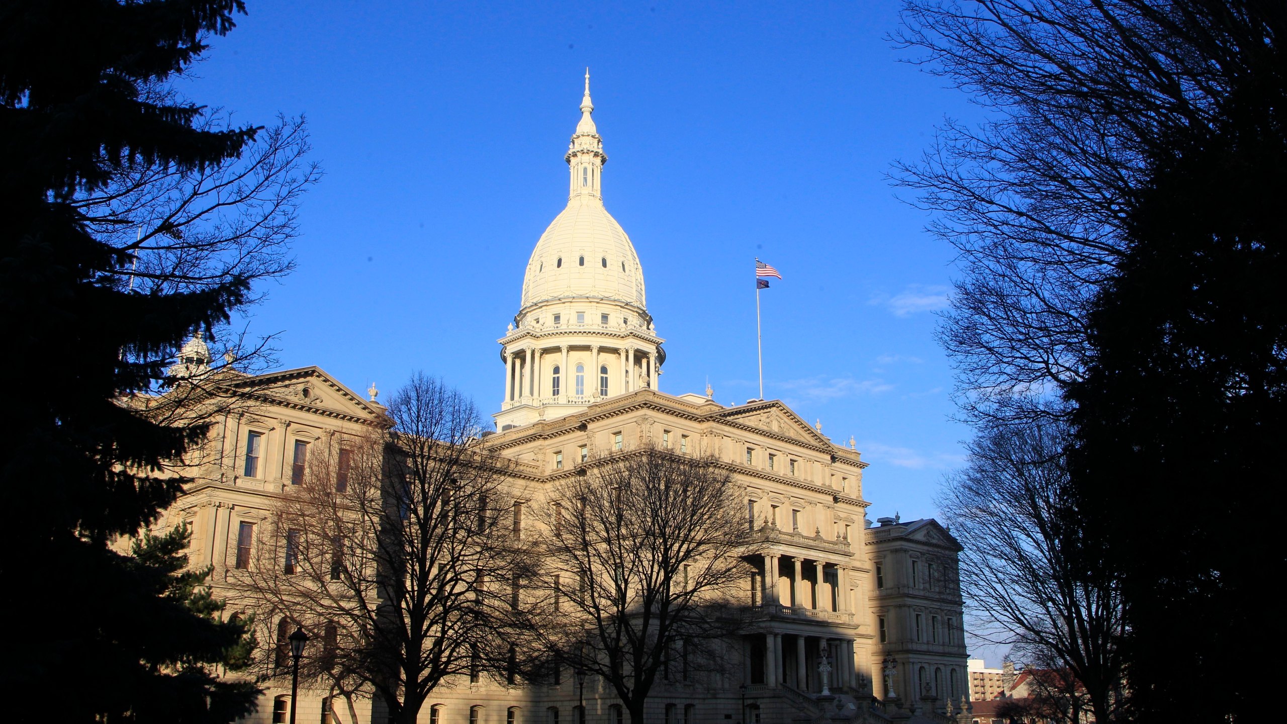 FILE - The Michigan Capitol building stands in Lansing, Mich., Dec. 12, 2012. Michigan Democrats continued efforts to protect abortion rights Wednesday, May 3, 2023, as the state Legislature advanced a bill that would outlaw companies from retaliating against employees for receiving abortions. (AP Photo/Carlos Osorio, File)