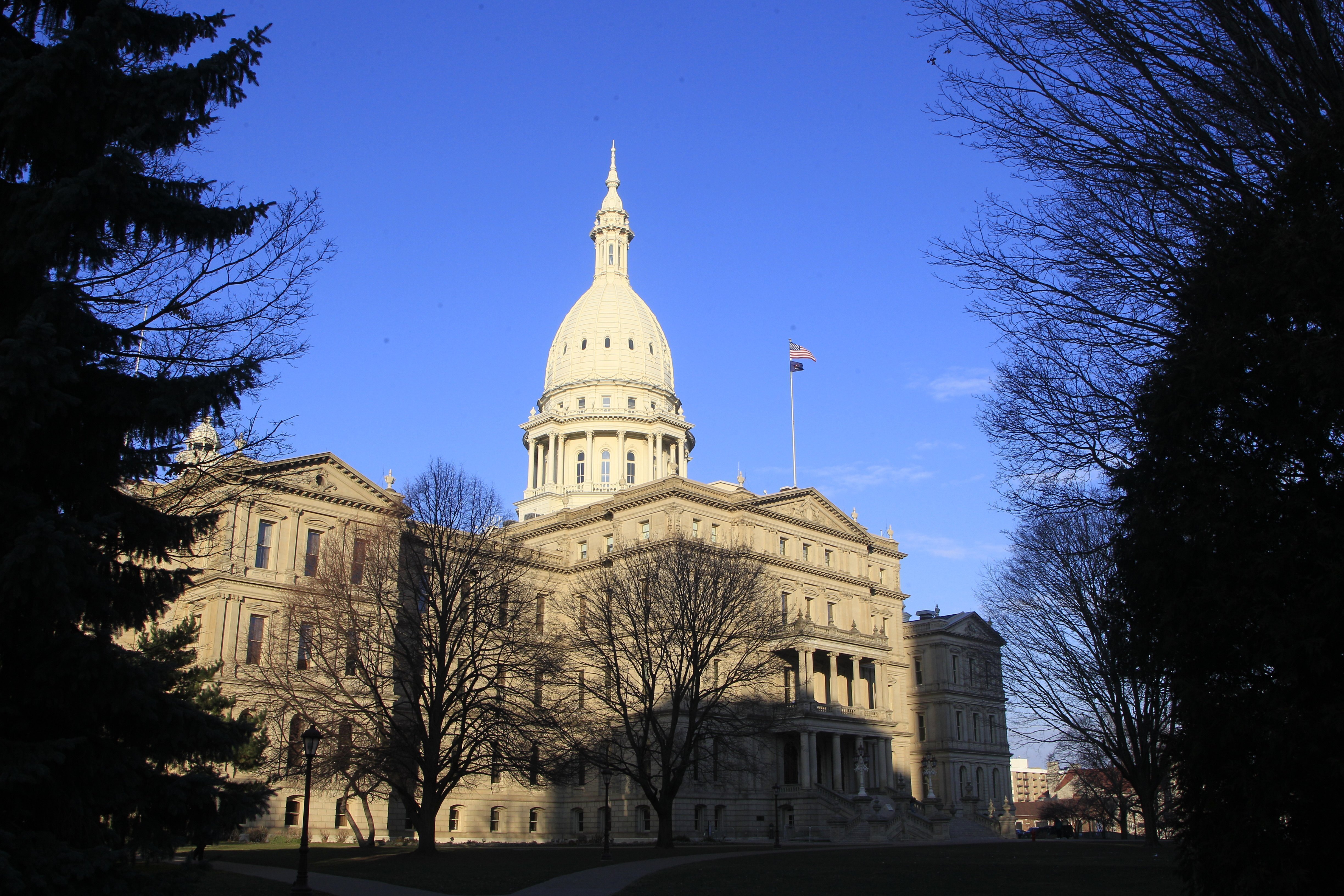 FILE - The Michigan Capitol building stands in Lansing, Mich., Dec. 12, 2012. Michigan Democrats continued efforts to protect abortion rights Wednesday, May 3, 2023, as the state Legislature advanced a bill that would outlaw companies from retaliating against employees for receiving abortions. (AP Photo/Carlos Osorio, File)