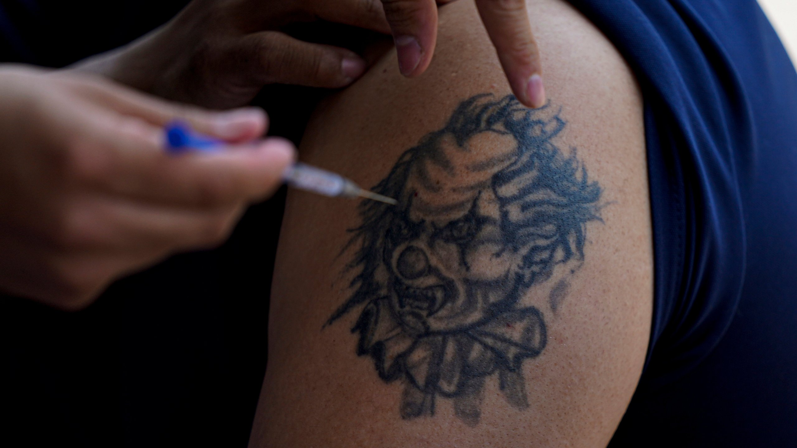 FILE - A youth gets a shot of Russia's Sputnik V coronavirus vaccine during a vaccination drive at University Stadium in Mexico City, Friday, July 23, 2021. Mexican officials celebrated Wednesday, May 3, 2023, the announcement that the country finally developed its own COVID-19 vaccine, more than two years after inoculations from the U.S., Europe and China were rolled out. (AP Photo/Fernando Llano, File)