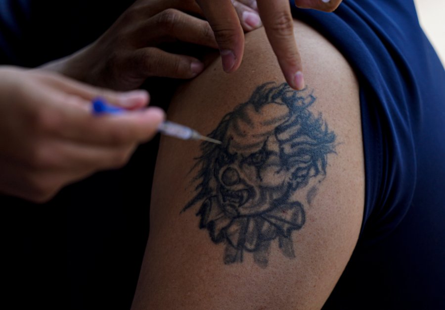 FILE - A youth gets a shot of Russia's Sputnik V coronavirus vaccine during a vaccination drive at University Stadium in Mexico City, Friday, July 23, 2021. Mexican officials celebrated Wednesday, May 3, 2023, the announcement that the country finally developed its own COVID-19 vaccine, more than two years after inoculations from the U.S., Europe and China were rolled out. (AP Photo/Fernando Llano, File)