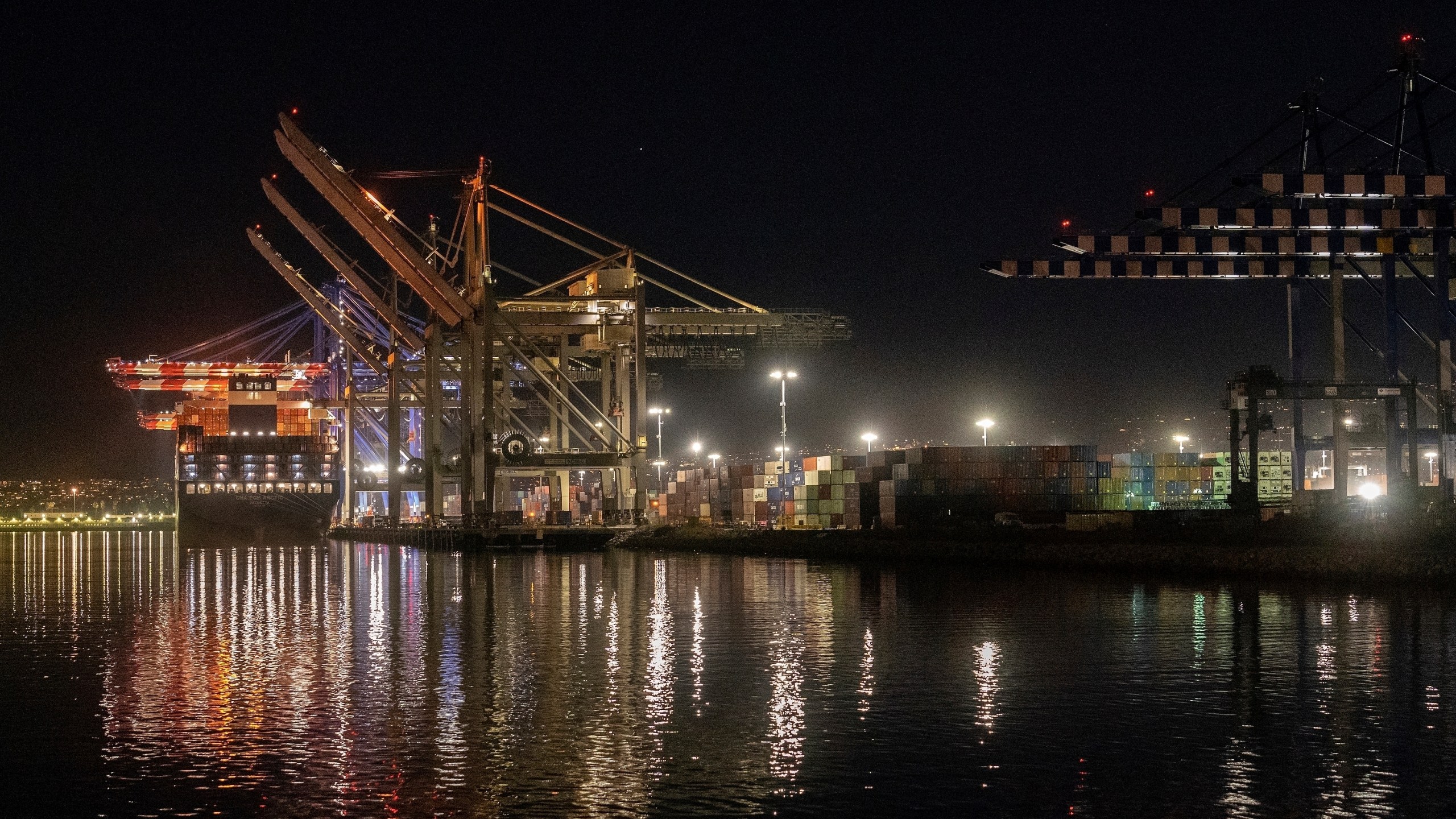 FILE - A ship is docked at the Port of Los Angeles on Nov. 21, 2022. A confidential document obtained by The Associated Press shows the International Chamber of Shipping advised its national branches in March that member companies should "give careful consideration to the possible implications" before committing to a new plan to reduce maritime emissions. (AP Photo/Damian Dovarganes, File)