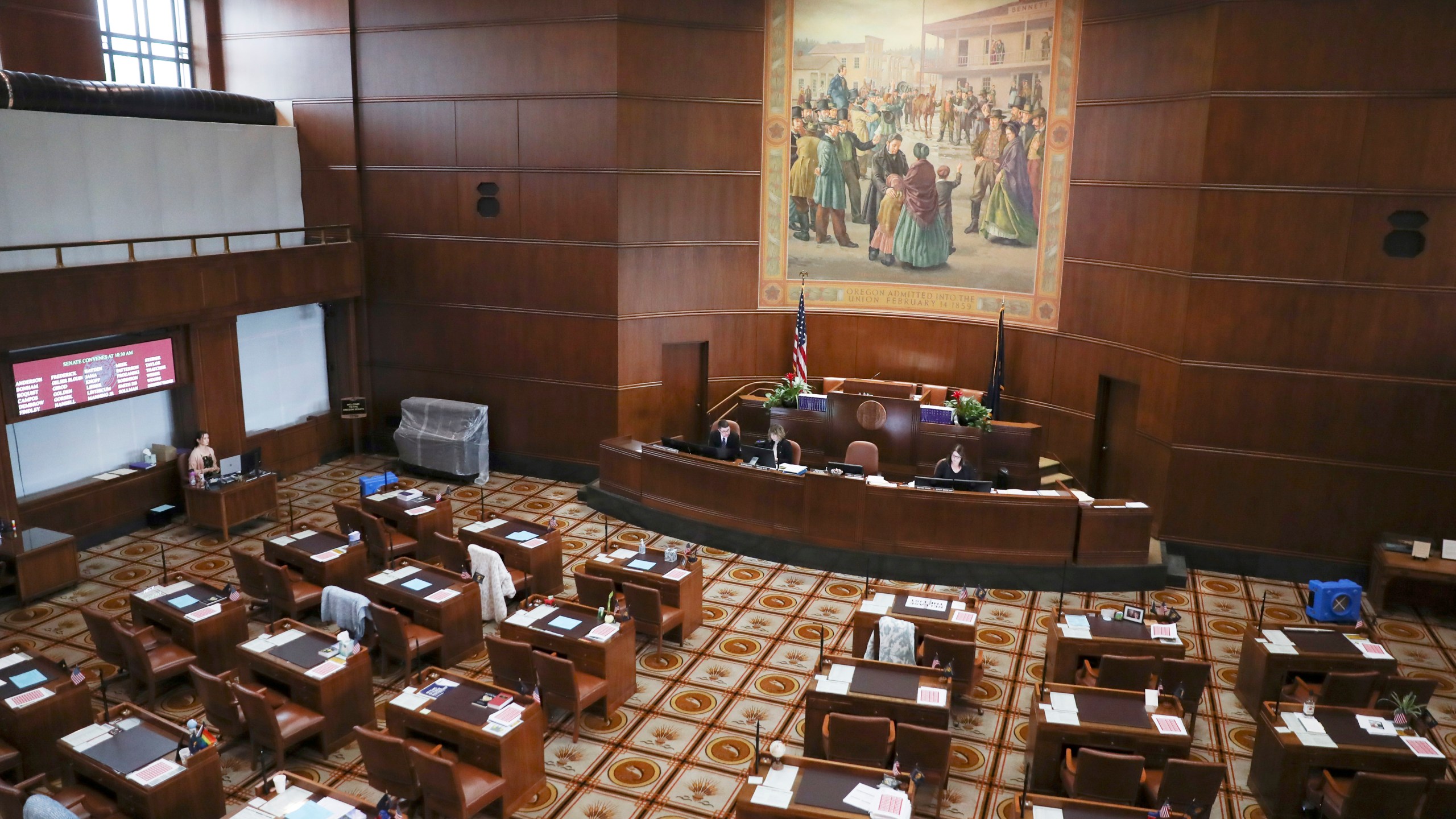 The Senate chambers sits nearly empty at the Oregon State Capitol in Salem, Ore., Thursday, May 4, 2023. Republican members of the Oregon Senate on Thursday extended their boycott of Senate proceedings into a second day, delaying action by the majority Democrats on bills on gun safety, abortion rights and gender-affirming health care. (AP Photo/Amanda Loman)