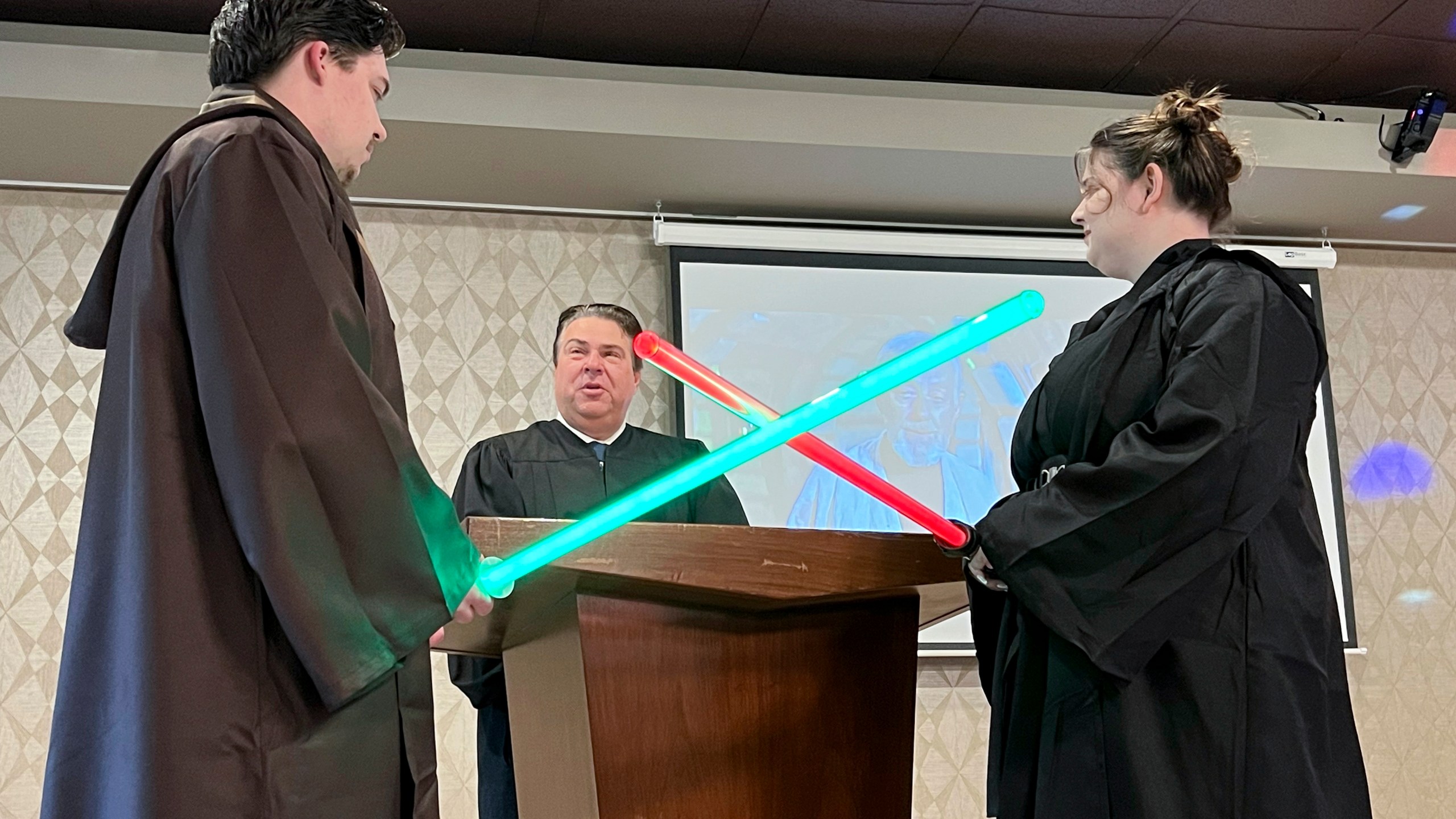 Julia and Robert Jones exchange vows during their wedding ceremony in Akron, Ohio, on Thursday, May 4, 2023. Couples celebrated May the Fourth with a "Star Wars" themed wedding. (AP Photo/Patrick Orsagos)