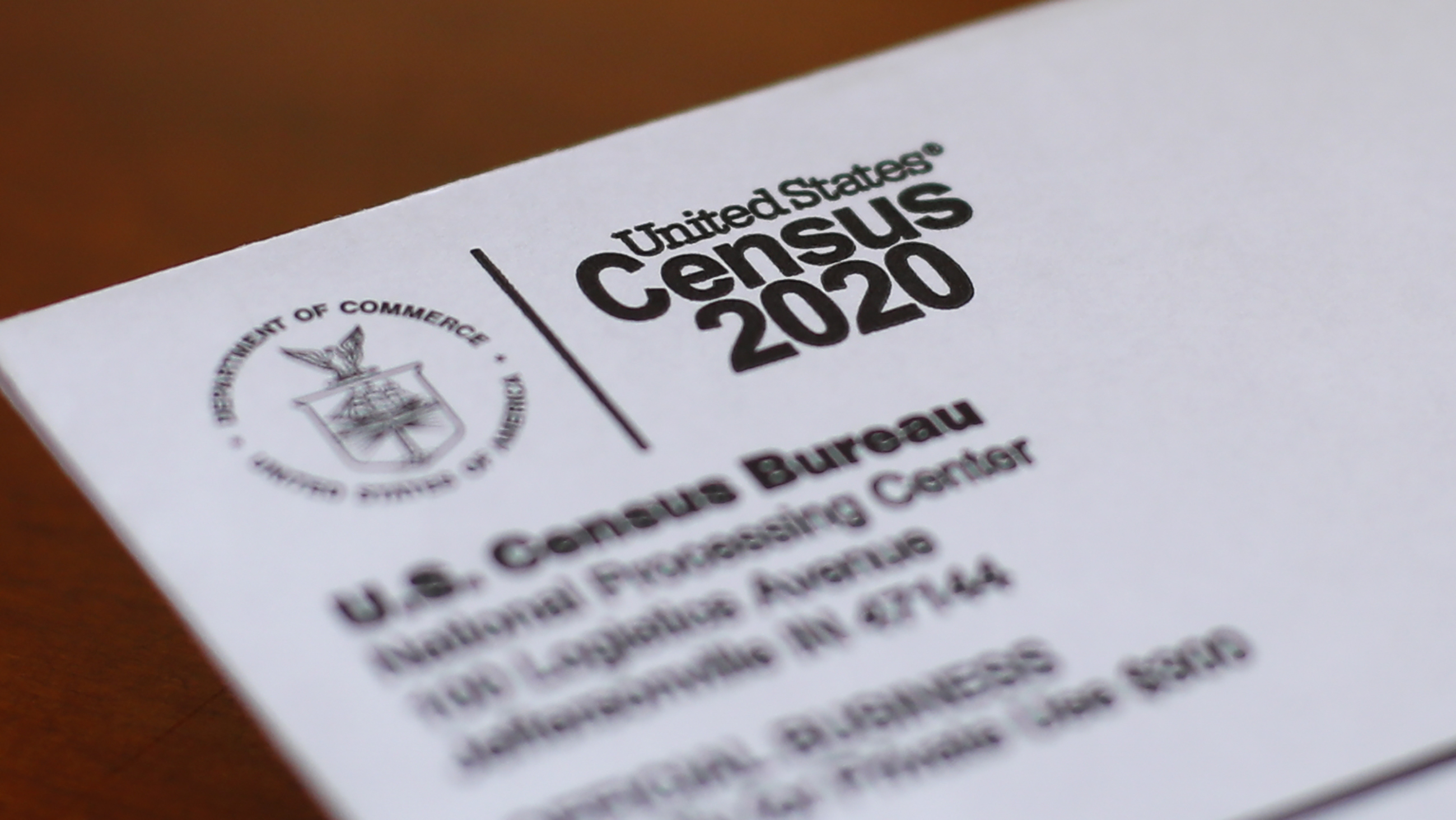 FILE - An envelope containing a 2020 census letter mailed to a U.S. resident sits on a desk on on April 5, 2020, in Detroit. The U.S. Census Bureau is contemplating getting rid of a question about a person's ancestry on its most comprehensive survey, saying it may duplicate a newly-revised race question that allows respondents to write in from where they or their antecedents came. (AP Photo/Paul Sancya, File)