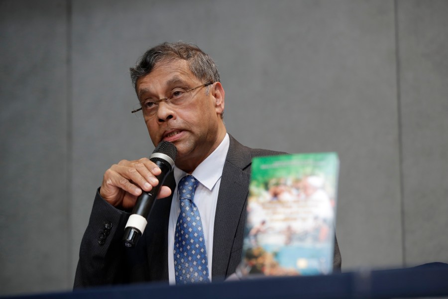 FILE - Aloysius John, Secretary General of Caritas Internationalis, speaks during a press conference to present a document on the 5th anniversary of Pope Francis' encyclical "Laudato si" (Praise Be) calling on the world to act to stop the human destruction of the planet, at the Vatican's press room, Thursday, June 18, 2020. The recently ousted head of the Vatican's main charitable organization is breaking six months of silence to denounce his removal as a “brutal power grab.” Aloysius John has penned an eight-page open letter to the Caritas confederation on the eve of a General Assembly, from May 11, 2023 to May 16, to elect his successor. (AP Photo/Alessandra Tarantino, File)