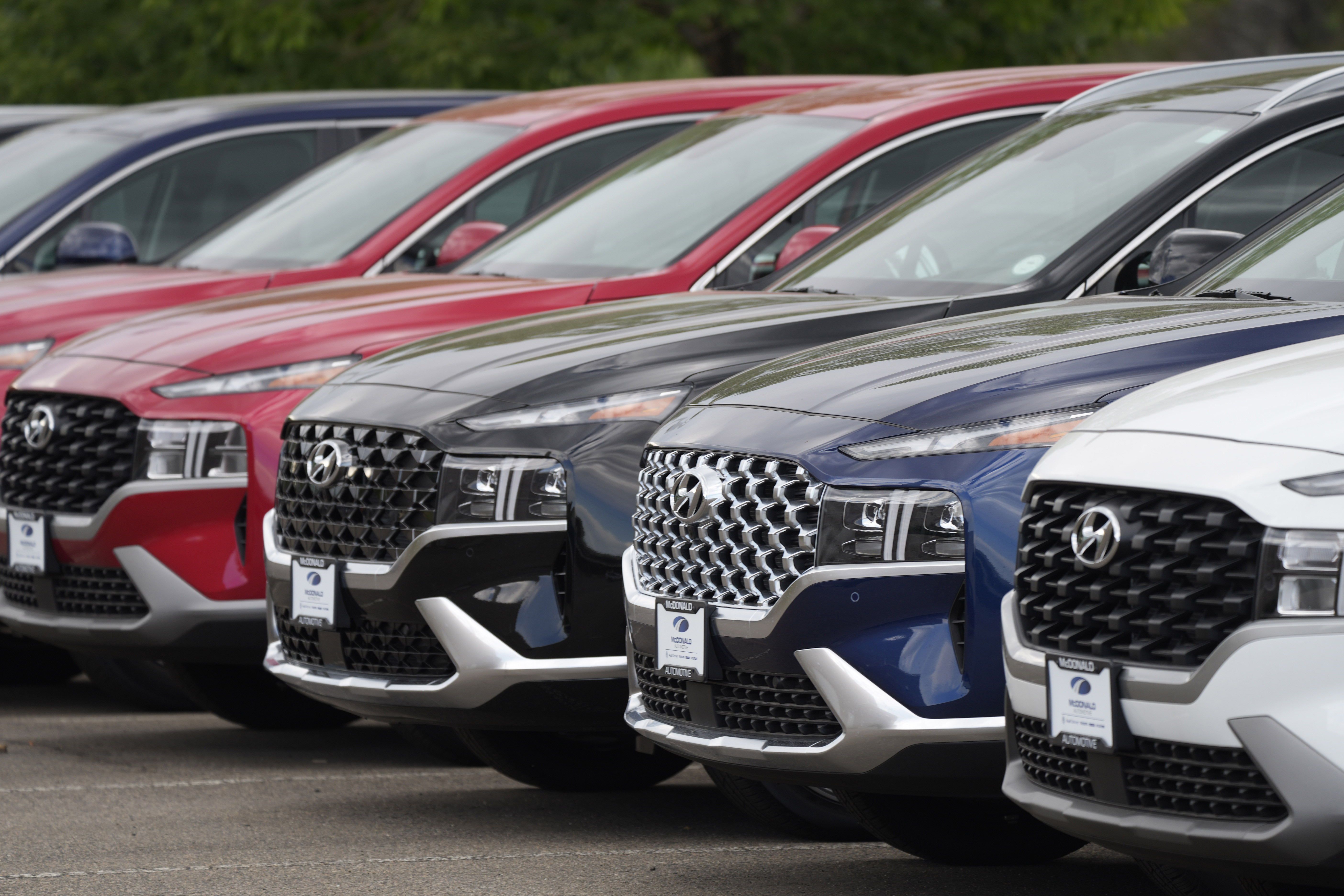 A line of 2022 Santa Fe SUV's sit outside a Hyundai dealership Sunday, Sept. 12, 2021, in Littleton, Colo. Nearly three months after Hyundai and Kia rolled out new software designed to thwart rampant auto thefts, crooks are still driving off with the vehicles at an alarming rate. (AP Photo/David Zalubowski)