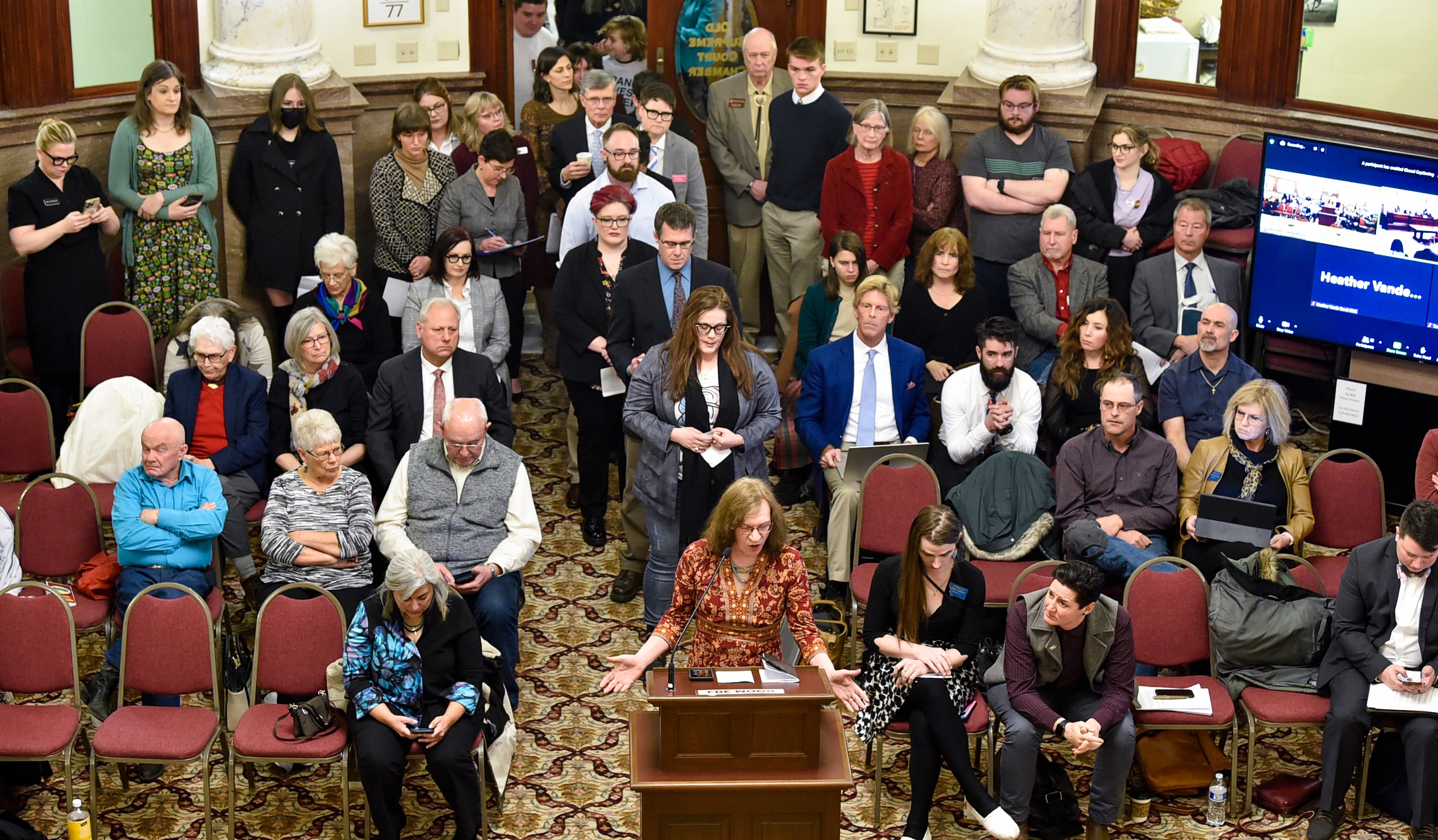 FILE - Opponents of a Montana bill banning gender-affirming medical care for transgender minors line up out the door of the Senate Judiciary Committee, Jan. 27, 2023, at the state Capitol in Helena, Mont. Two transgender children, their parents and two health care providers filed a lawsuit Tuesday, May 9, arguing that the Montana law that would ban gender-affirming care for transgender youth is unconstitutional. (Thom Bridge/Independent Record via AP, File)