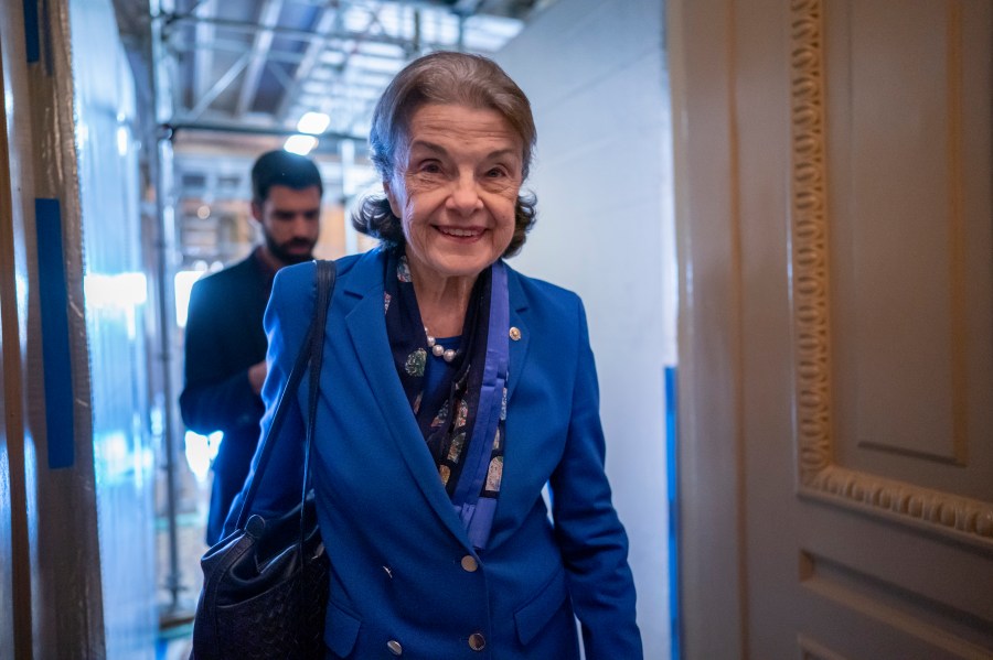 FILE - Sen. Dianne Feinstein, D-Calif., walks through a Senate corridor at the Capitol in Washington, Feb. 14, 2023. Feinstein is returning to Washington after a more than two month absence led to calls from within her own party for the oldest member of Congress to resign. The California Democrat announced in early March that she had been hospitalized in San Francisco and was being treated for a case of shingles. The 89-year-old senator planned to be back in Washington in March but never appeared as her recovery took longer than expected. (AP Photo/J. Scott Applewhite, File)