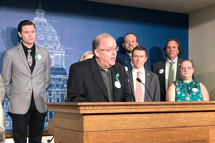 Michael Strande speaks at a news conference at the Minnesota State Capitol, Tuesday, May 9, 2023, in St. Paul, Minn., in support of state legislation to ban non-essential uses of "forever chemicals" also known as PFAS. The legislation is named after his daughter, Amara Strande, who spent the last months of her life campaigning for restrictions that will be some of the toughest in the country. Amara died two days shy of her 21st birthday last month from a rare form of liver cancer. (AP Photo/Steve Karnowski)