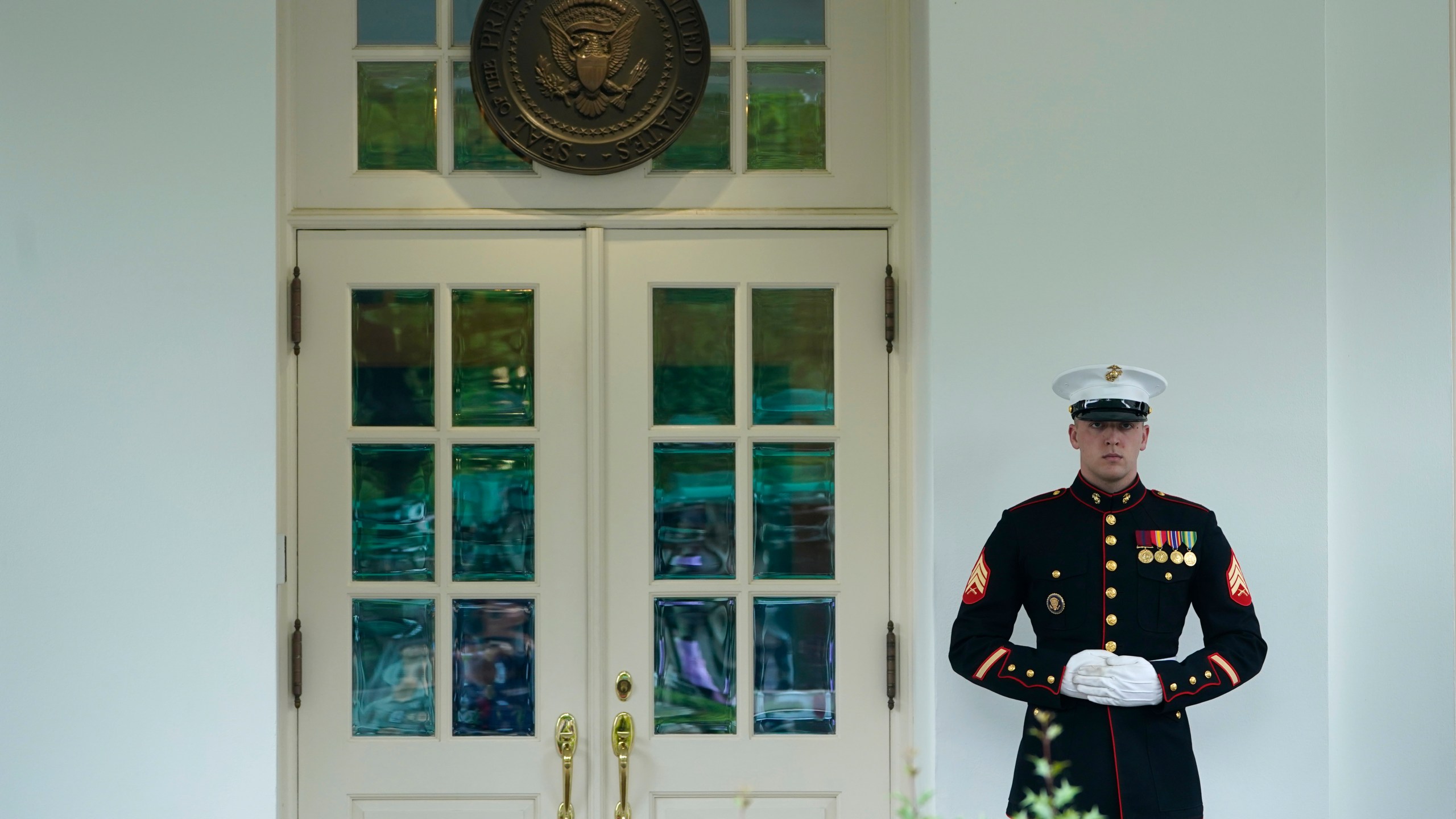 A Marine stands guard outside of the West Wing of the White House in Washington, Tuesday, May 9, 2023. President Biden is meeting with Congressional leaders to discuss the debt limit. (AP Photo/Susan Walsh)