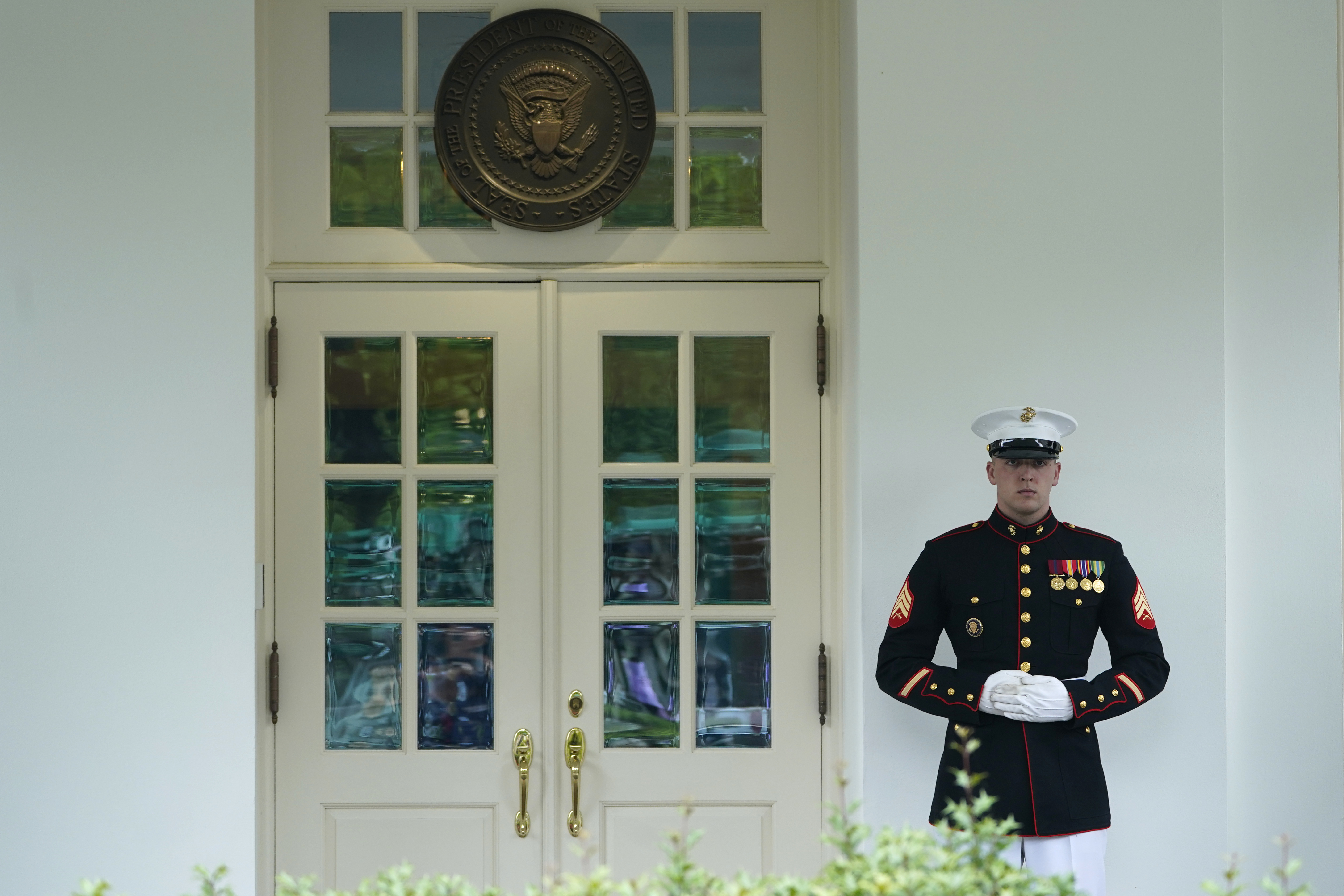 A Marine stands guard outside of the West Wing of the White House in Washington, Tuesday, May 9, 2023. President Biden is meeting with Congressional leaders to discuss the debt limit. (AP Photo/Susan Walsh)