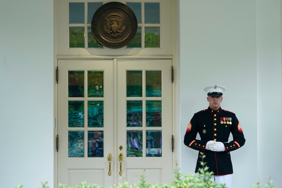 A Marine stands guard outside of the West Wing of the White House in Washington, Tuesday, May 9, 2023. President Biden is meeting with Congressional leaders to discuss the debt limit. (AP Photo/Susan Walsh)