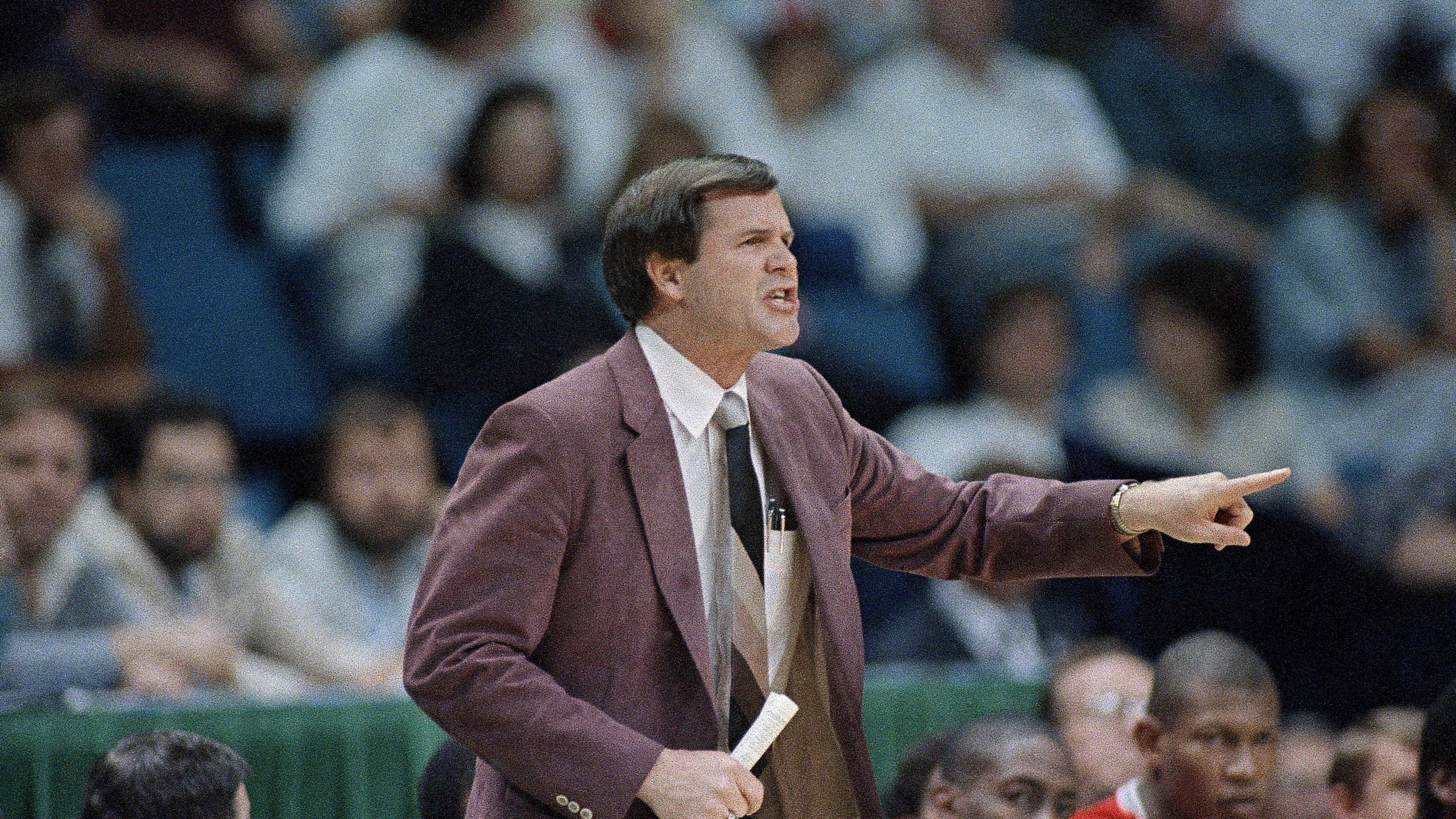 FILE - Louisville coach Denny Crum yells from the sideline during the first half of an NCAA college basketball semifinal game against LSU at Reunion Arena, Saturday, March 29, 1986, Dallas, Texas. Denny Crum, who won two NCAA men’s basketball championships and built Louisville into one of the 1980s’ dominant programs during a Hall of Fame coaching career, died Tuesday, May 9, 2023. He was 86. (AP Photo/David Longstreath, File)