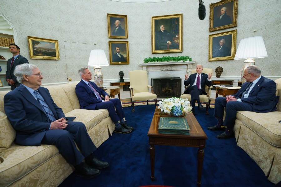 Senate Minority Leader Mitch McConnell of Ky., Speaker of the House Kevin McCarthy of Calif., and Senate Majority Leader Sen. Chuck Schumer of N.Y., listen as President Joe Biden speaks before a meeting to discuss the debt limit in the Oval Office of the White House, Tuesday, May 9, 2023, in Washington. (AP Photo/Evan Vucci)