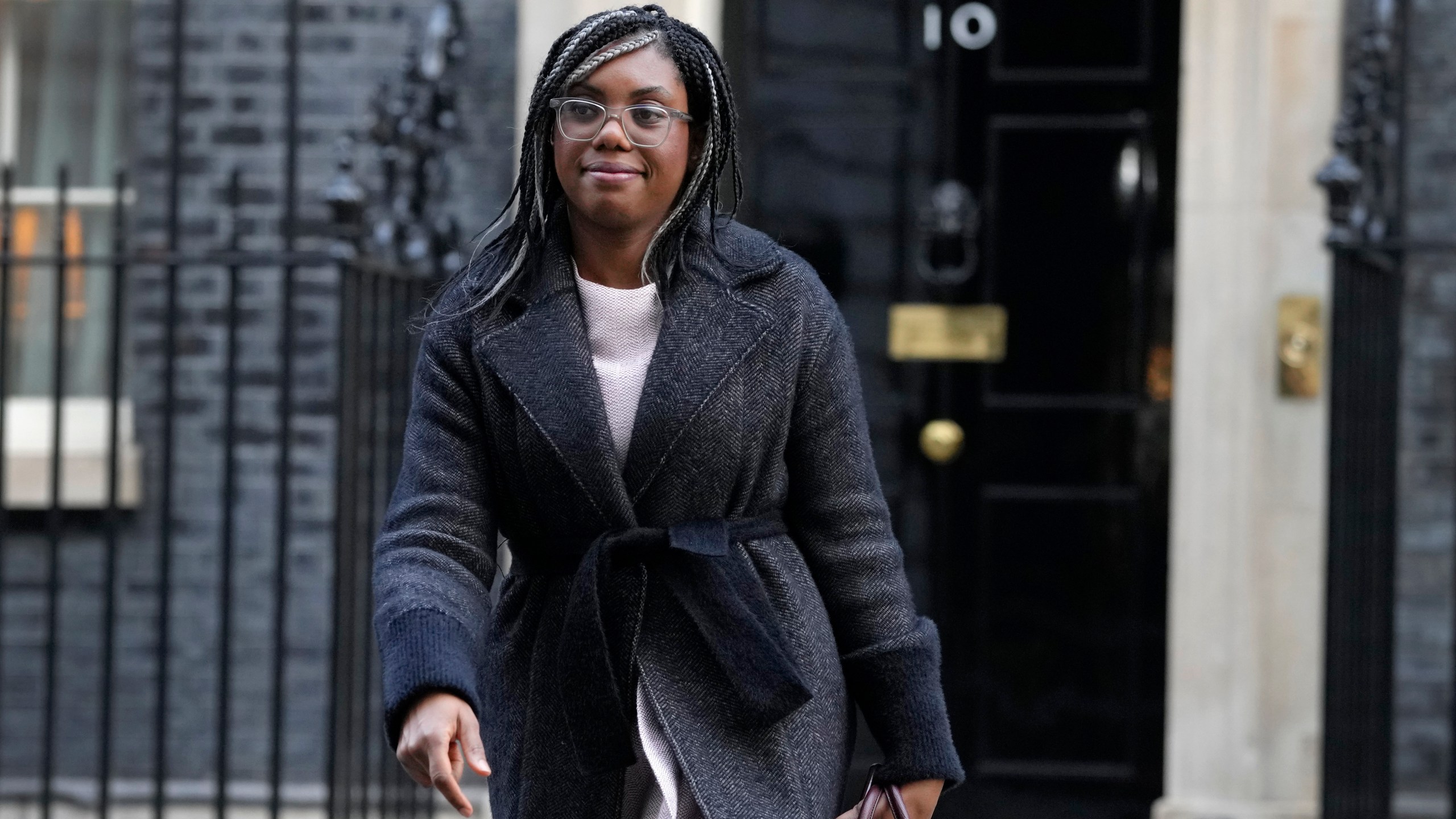 FILE - Kemi Badenoch, Britain's Secretary of State for International Trade and President of the Board of Trade, Minister for Women and Equalities leaves after attending a cabinet meeting in Downing Street in London, on Jan. 17, 2023. The U.K. government on Wednesday May 10, 2023 scrapped plan to remove all remaining EU laws, some 4,000 in all, from British statute books by the end of this year — a post-Brexit goal that critics said was rash and unachievable. Badenoch said in a written statement that the government would instead draw up a list of about 600 specific laws that would be revoked. (AP Photo/Kirsty Wigglesworth, File)