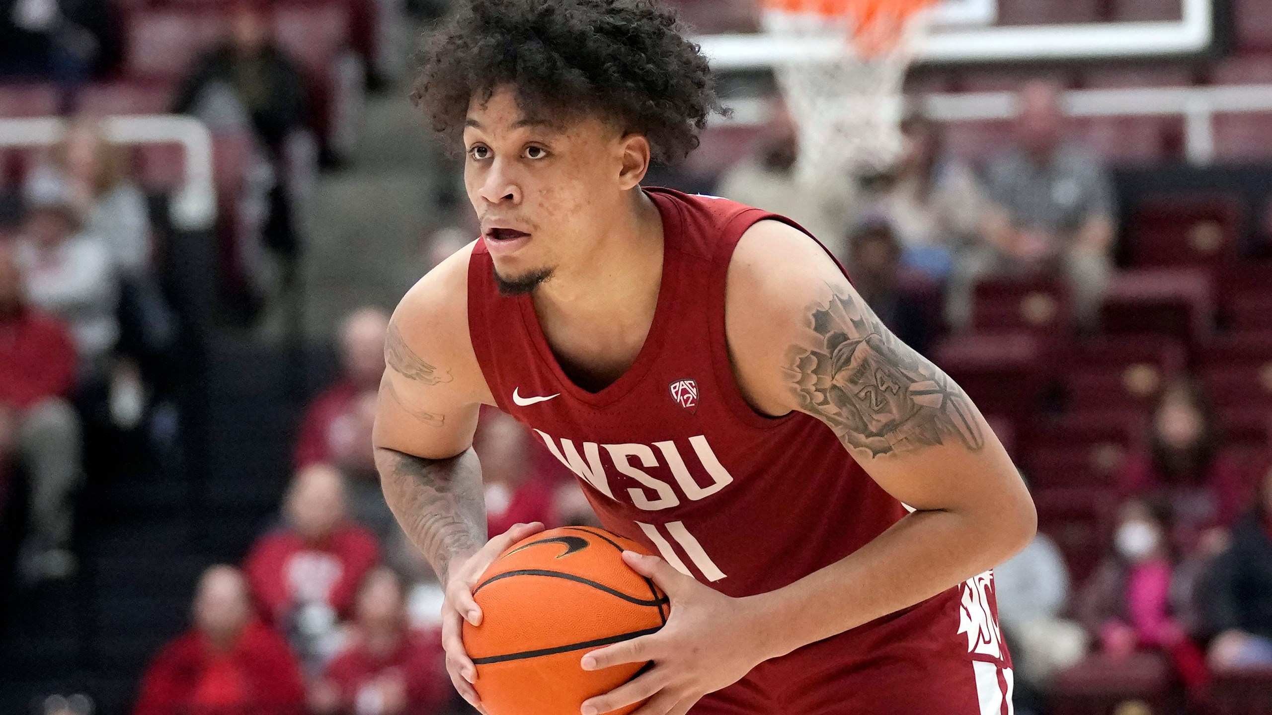 FILE - Washington State forward DJ Rodman (11) during an NCAA college basketball game against Stanford in Stanford, Calif., Thursday, Feb. 23, 2023. Southern California have already landed Bronny James, son of Los Angeles Lakers superstar LeBron James. Now, D.J. Rodman, the son of NBA rebounding great Dennis Rodman, has announced on social media that he's transferring to USC. Rodman will take advantage of an NCAA rule allowing an extra year of eligibility because of the COVID-19 pandemic to play for the Trojans close to his hometown of Newport Beach, Calif. (AP Photo/Jeff Chiu, File)