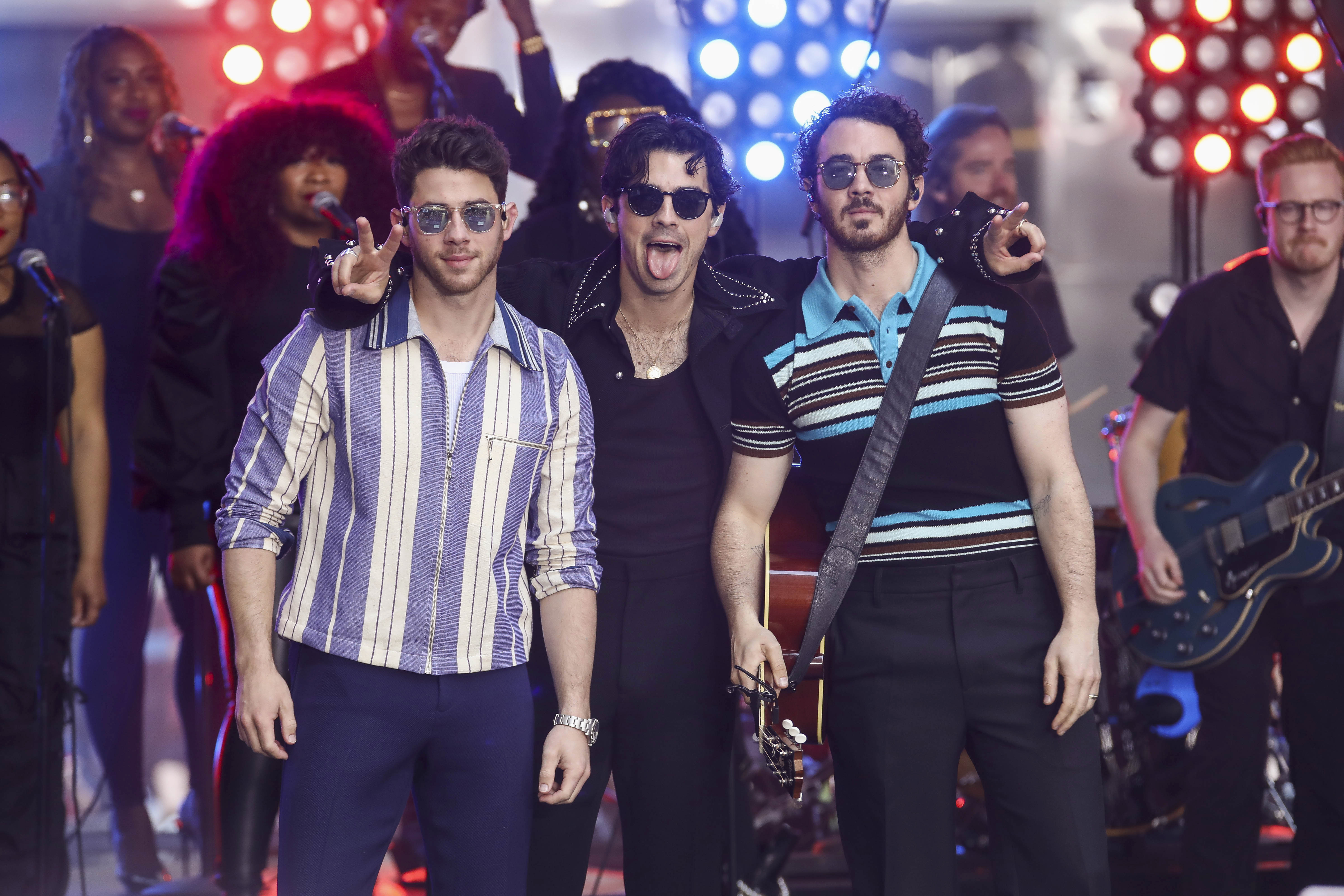 Nick Jonas, from left, Joe Jonas and Kevin Jonas of the Jonas Brothers perform on NBC's Today show at Rockefeller Plaza on Friday, May 12, 2023, in New York. (Photo by Andy Kropa/Invision/AP)