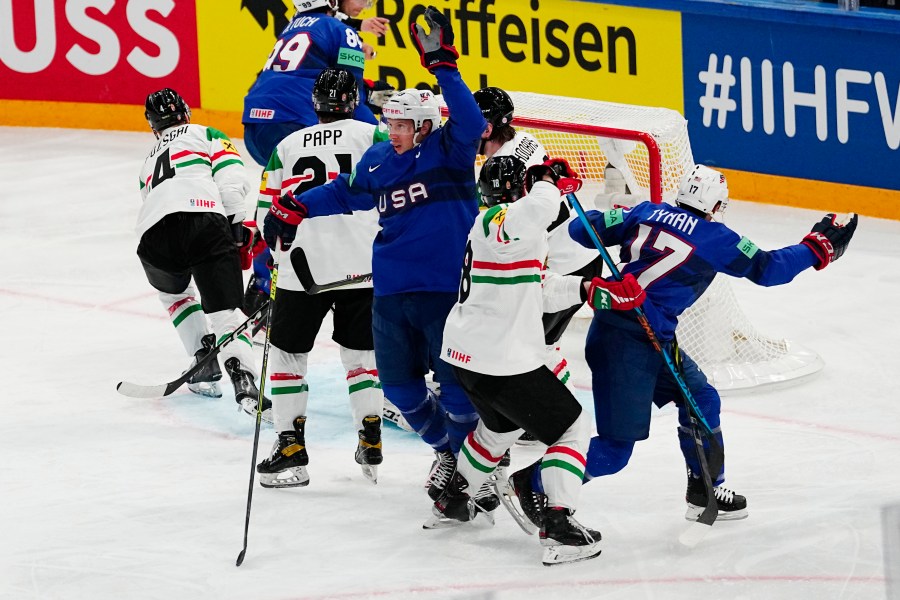 United States Nick Bonino, centre, celebrates after scoring his side's third goal during the group A match between United States and Hungary at the ice hockey world championship in Tampere, Finland, Sunday, May 14, 2023. (AP Photo/Pavel Golovkin)