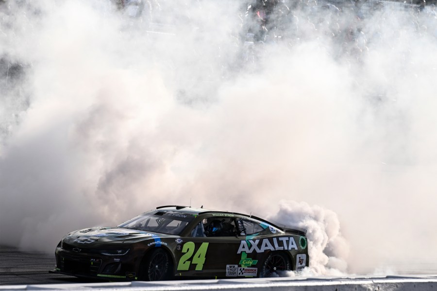 William Byron (24) does a burnout after winning a NASCAR Cup Series auto race at Darlington Raceway, Sunday, May 14, 2023, in Darlington, S.C. (AP Photo/Matt Kelley)