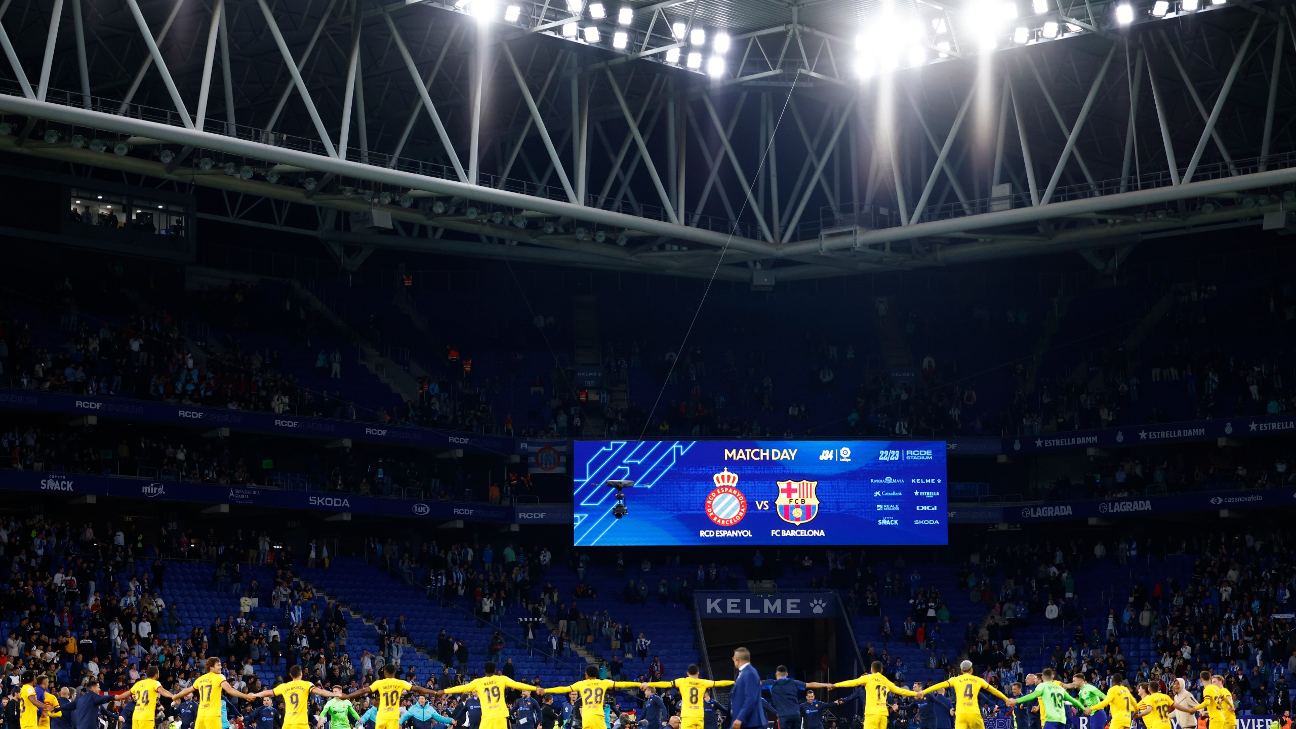 Barcelona players celebrate after the Spanish La Liga soccer match between Espanyol and Barcelona at the RCDE stadium in Barcelona, Sunday, May 14, 2023. (AP Photo/Joan Monfort)