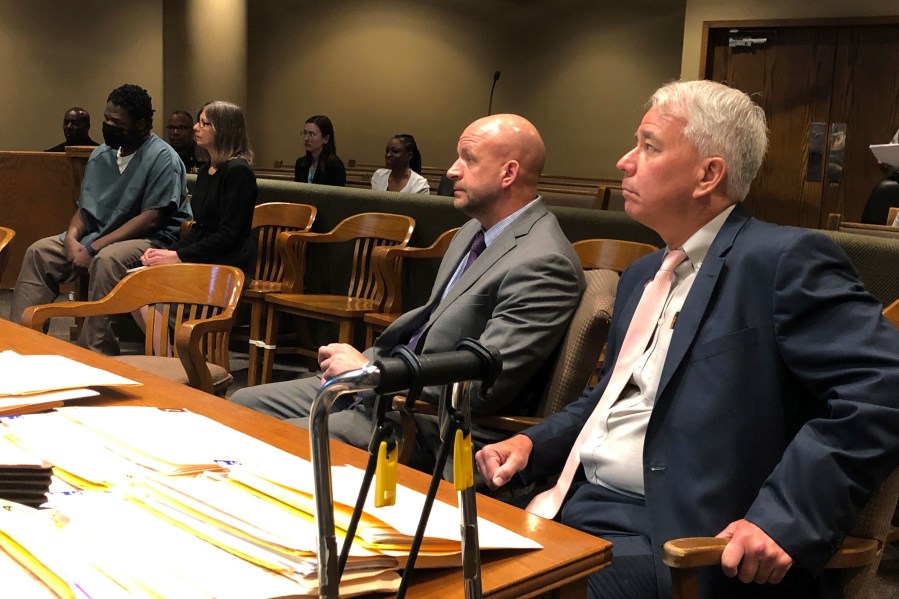 From left, Cleotha Abston, his lawyer Jennifer Case, prosecutor Paul Hagerman, Shelby County District Attorney Steve Mulroy sit in court in Memphis, Tenn, on Thursday, July 6, 2023. Memphis prosecutors say they will seek the death penalty against Abston, who's charged with kidnapping a school teacher during an early morning run and killing her. (AP Photo/Adrian Sainz)
