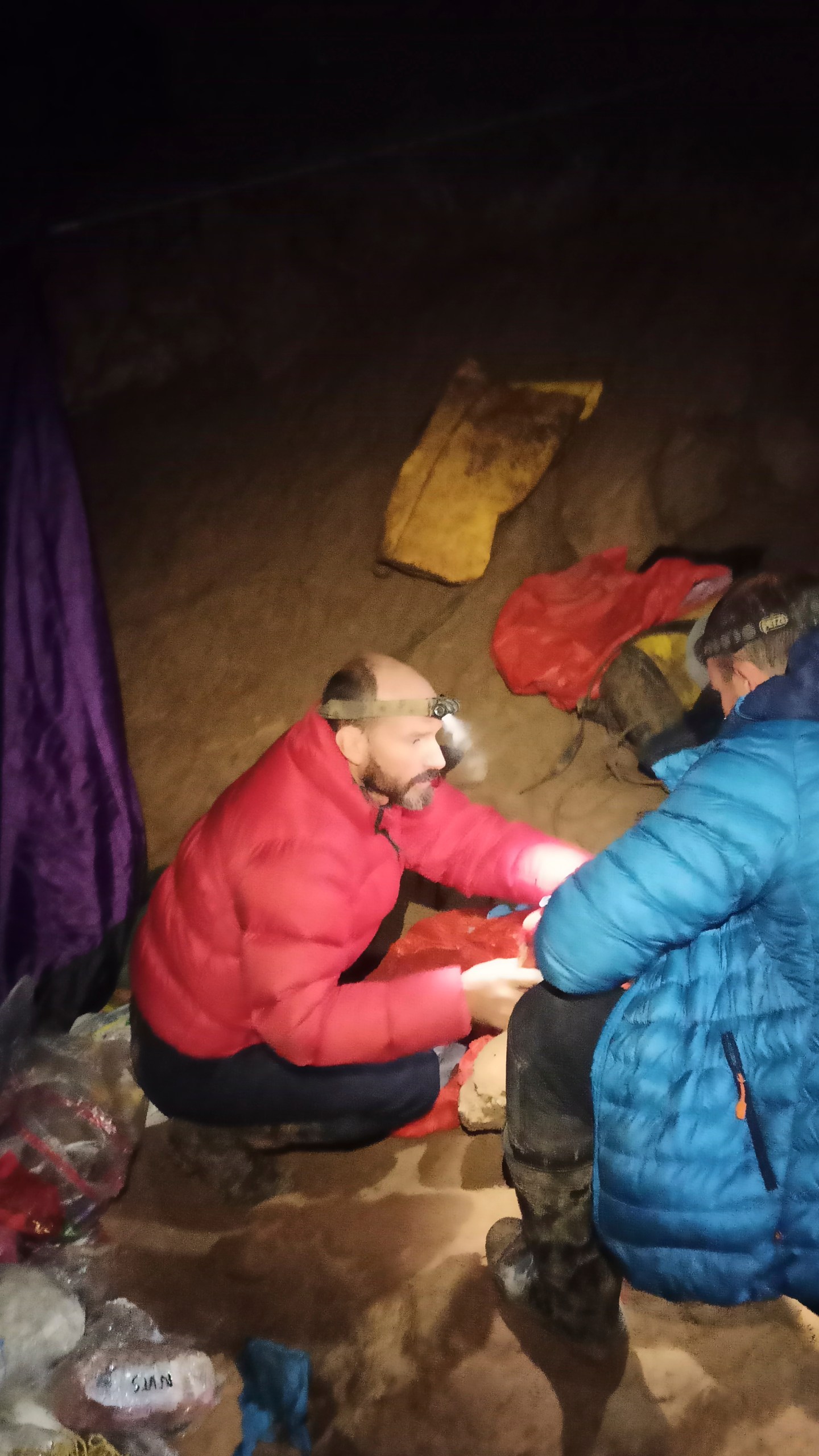 American caver Mark Dickey, left, 40, talks to a colleague inside the Morca cave near Anamur, southern Turkey, Thursday, Sept. 7, 2023. Turkish and international cave rescue experts are working to save an American speleologist trapped at a depth of more than 1,000 meters (3,280 feet) in a cave in southern Turkey after he became ill. (Turkish Government Directorate of Communications via AP)