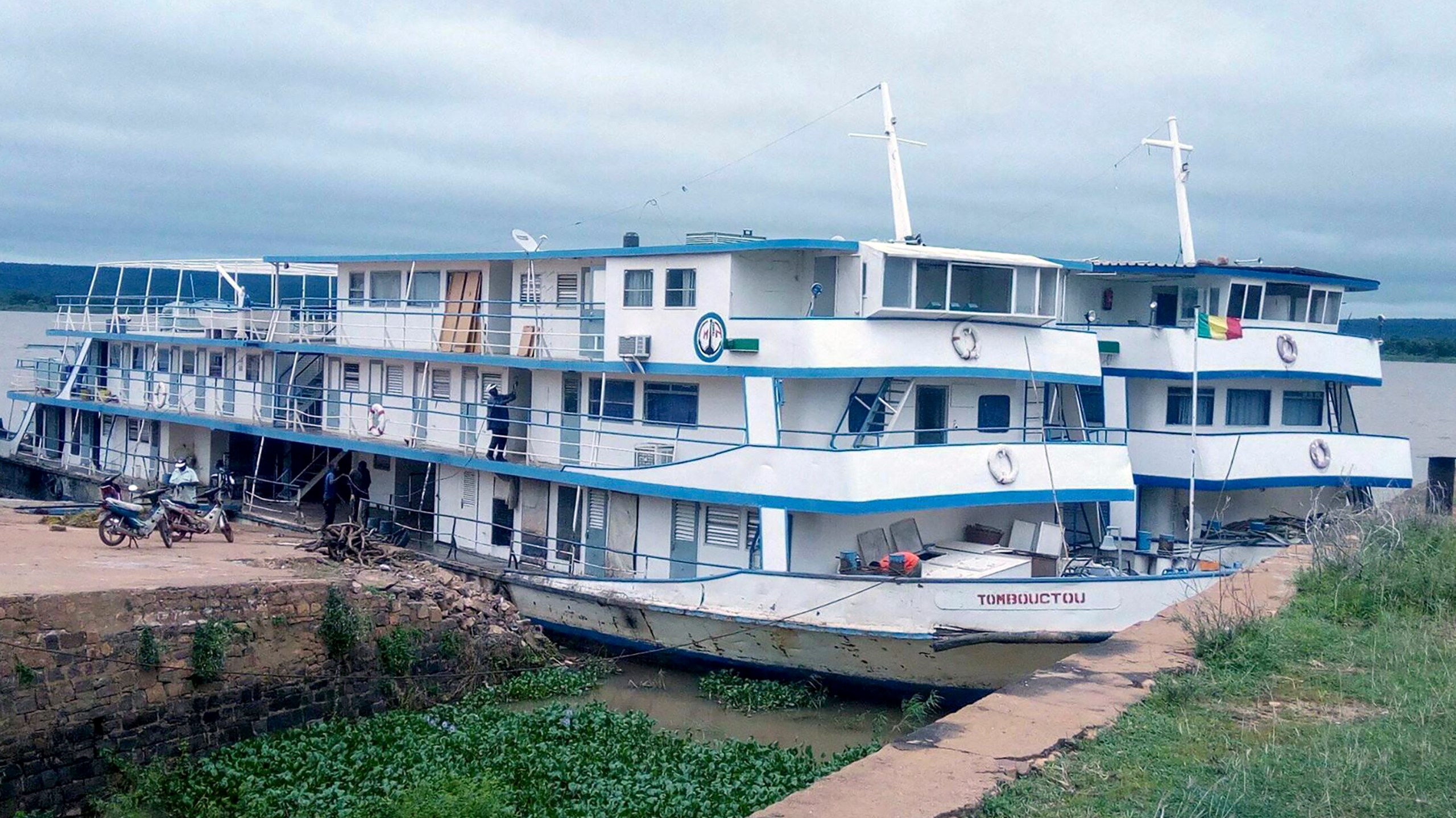 This undated photograph released by the Compagnie Malienne de Navigation (COMANAV) shows their boat called Tombouctou at dock on the Niger River in Mali. A Malian government statement said the passenger boat was attacked near the village of Zarho, about 90 kilometers (55 miles) east of Timbuktu Thursday, Sept. 7, 2023. Al-Qaida-linked insurgents killed 49 civilians and 15 government soldiers in two separate assault, the boat, and a military camp, the military said. (Comanav via AP)