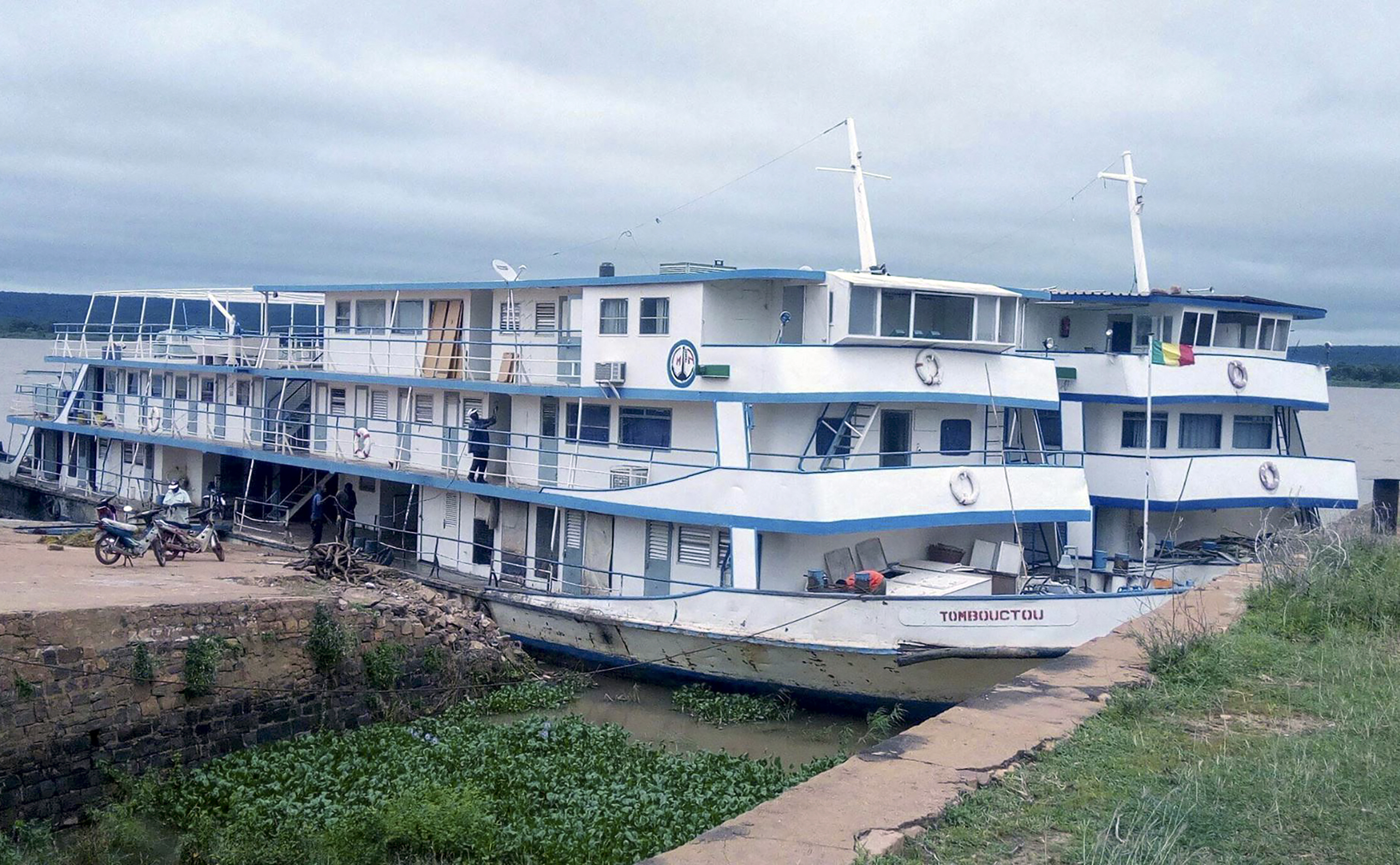 This undated photograph released by the Compagnie Malienne de Navigation (COMANAV) shows their boat called Tombouctou at dock on the Niger River in Mali. A Malian government statement said the passenger boat was attacked near the village of Zarho, about 90 kilometers (55 miles) east of Timbuktu Thursday, Sept. 7, 2023. Al-Qaida-linked insurgents killed 49 civilians and 15 government soldiers in two separate assault, the boat, and a military camp, the military said. (Comanav via AP)