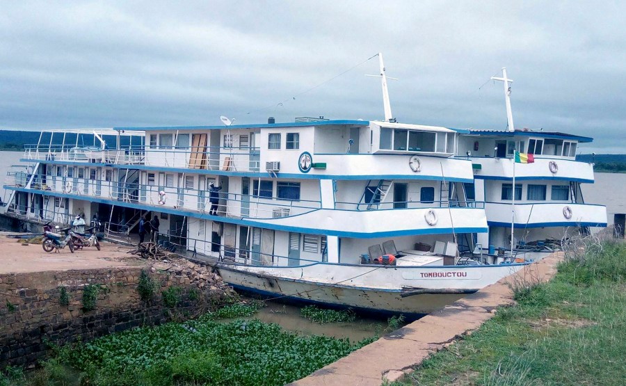 This undated photograph released by the Compagnie Malienne de Navigation (COMANAV) shows their boat called Tombouctou at dock on the Niger River in Mali. A Malian government statement said the passenger boat was attacked near the village of Zarho, about 90 kilometers (55 miles) east of Timbuktu Thursday, Sept. 7, 2023. Al-Qaida-linked insurgents killed 49 civilians and 15 government soldiers in two separate assault, the boat, and a military camp, the military said. (Comanav via AP)