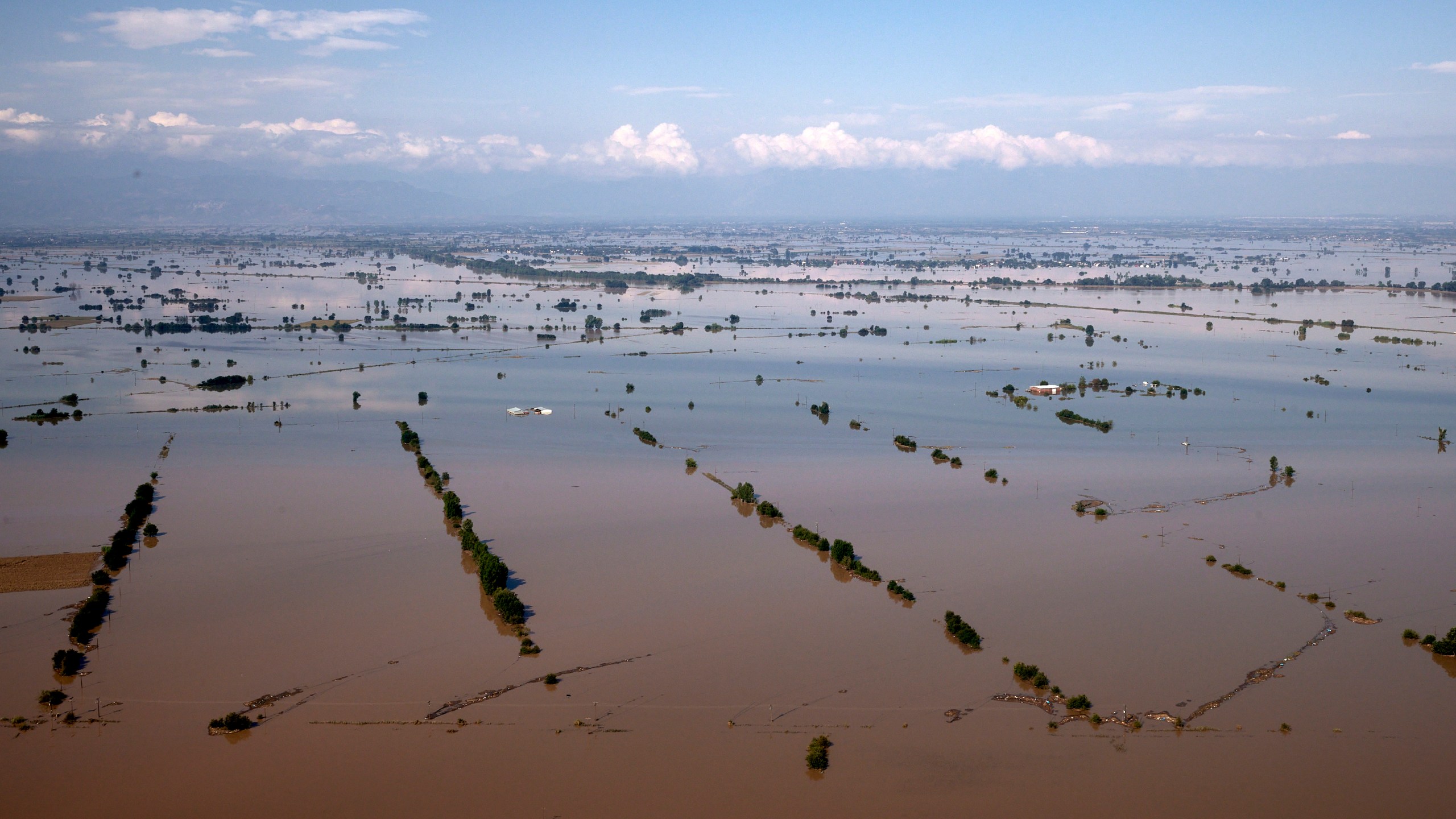 In this photo provided by the Greek Prime Minister's Office, floodwaters cover a plain, in Thessaly region, on Friday, Sept. 8, 2023. Severe rainstorms eased but floodwaters were still rising in parts of central Greece Friday, while fire department and military helicopters were plucking people from villages inundated by tons of water and mud that have left several people dead and others missing and many people clinging to the roofs of their homes, appealing for rescue. (Dimitris Papamitsos/Greek Prime Minister's Office via AP)