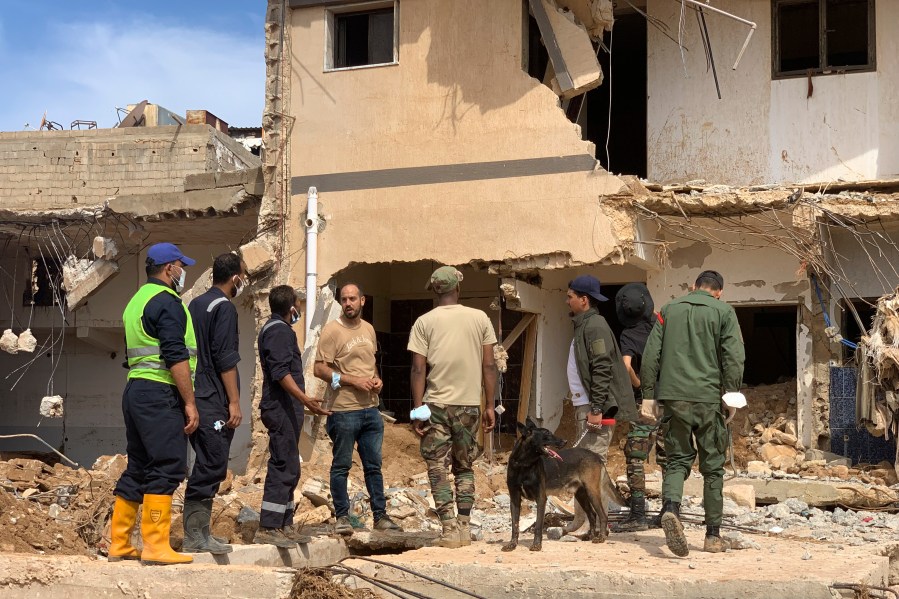 Rescue teams search for victims in Derna, Libya, on Sunday, Sept. 17, 2023. Libyan authorities have opened an investigation into the collapse of two dams that caused a devastating flood in a Derna as rescue teams searched for bodies on Saturday, nearly a week after the deluge killed more than 11,000 people. (AP Photo/Yousef Murad)