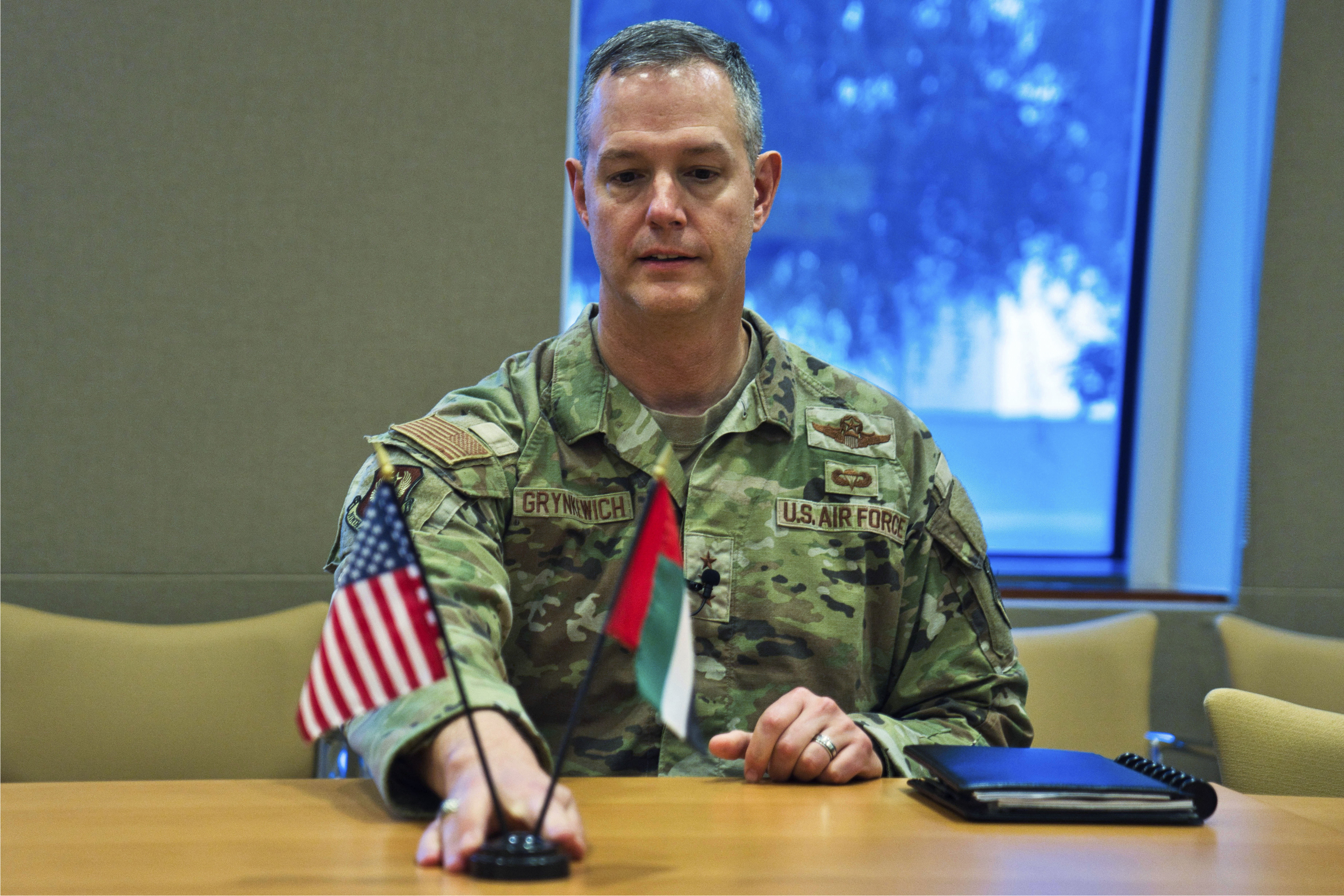 Lt. Gen. Alexus Grynkewich, the head of U.S. Air Force Central, adjusts a stand displaying small American and Emirati flags at the U.S. Embassy in Abu Dhabi, United Arab Emirates Wednesday, Sept. 20, 2023. Iran's supplying of bomb-carrying drones to Russia could see Moscow help Tehran's program become more lethal, raising risks across the wider Middle East, the top U.S. Air Force commander in the Middle East said Wednesday. (AP Photo/Jon Gambrell)