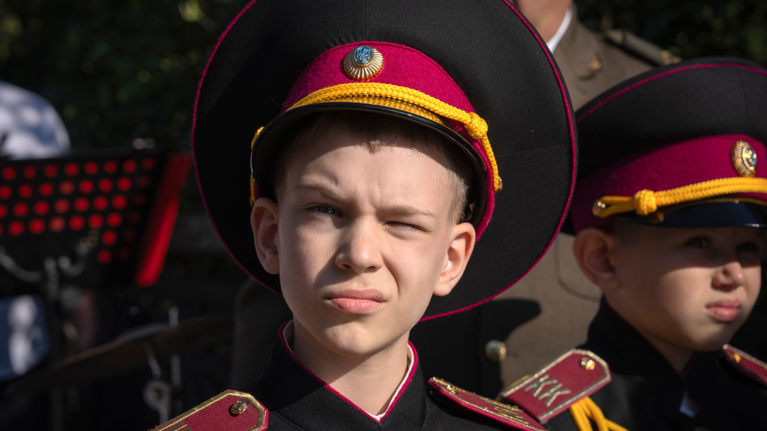 A young cadet looks on as he attends a swear-in ceremony at a monument to legendary Prince Volodymyr, one of the symbols of the Ukrainian capital in Kyiv, Ukraine, Friday, Sept. 29, 2023. (AP Photo/Efrem Lukatsky)