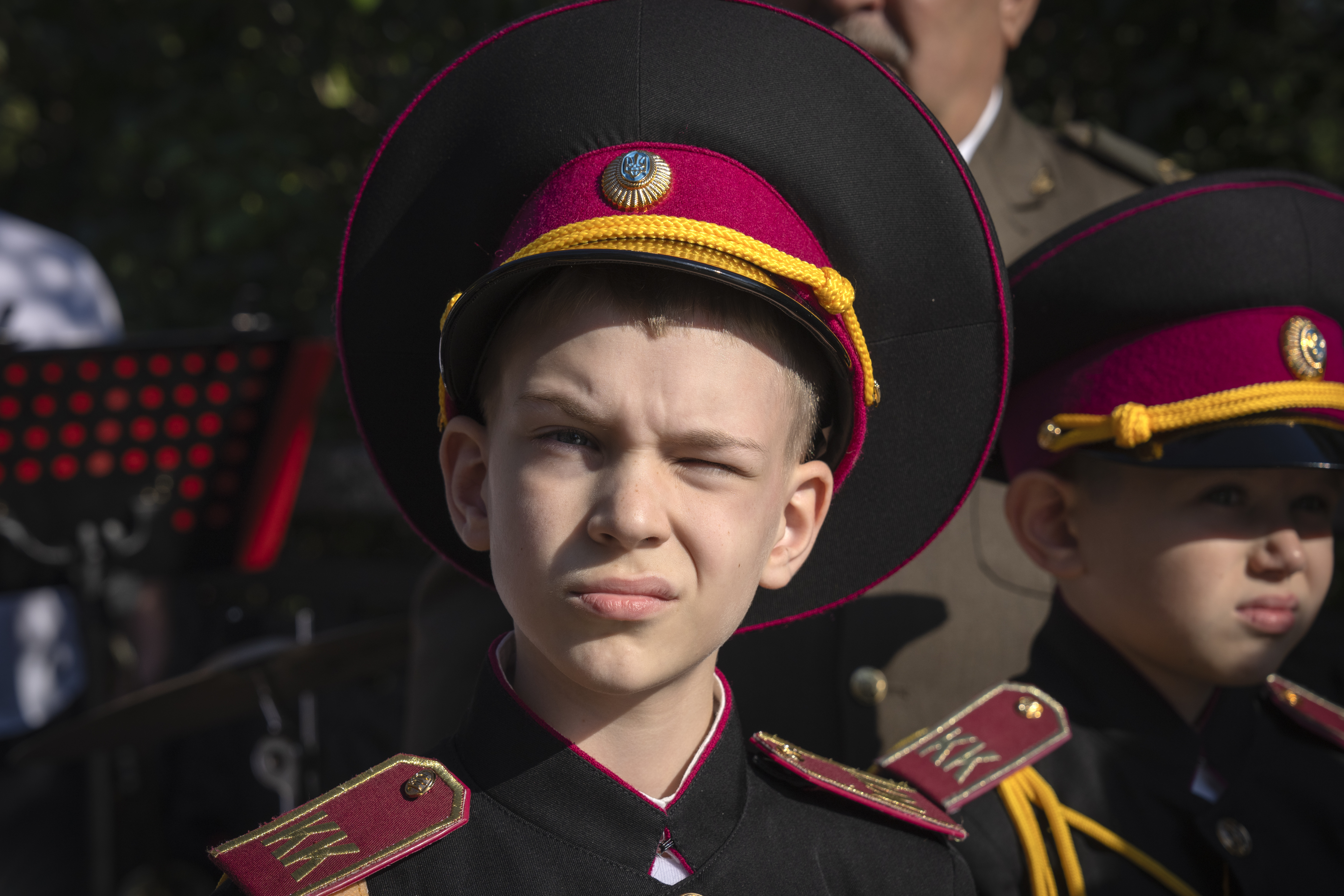 A young cadet looks on as he attends a swear-in ceremony at a monument to legendary Prince Volodymyr, one of the symbols of the Ukrainian capital in Kyiv, Ukraine, Friday, Sept. 29, 2023. (AP Photo/Efrem Lukatsky)