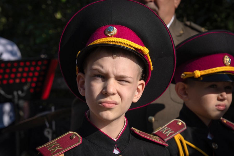 A young cadet looks on as he attends a swear-in ceremony at a monument to legendary Prince Volodymyr, one of the symbols of the Ukrainian capital in Kyiv, Ukraine, Friday, Sept. 29, 2023. (AP Photo/Efrem Lukatsky)