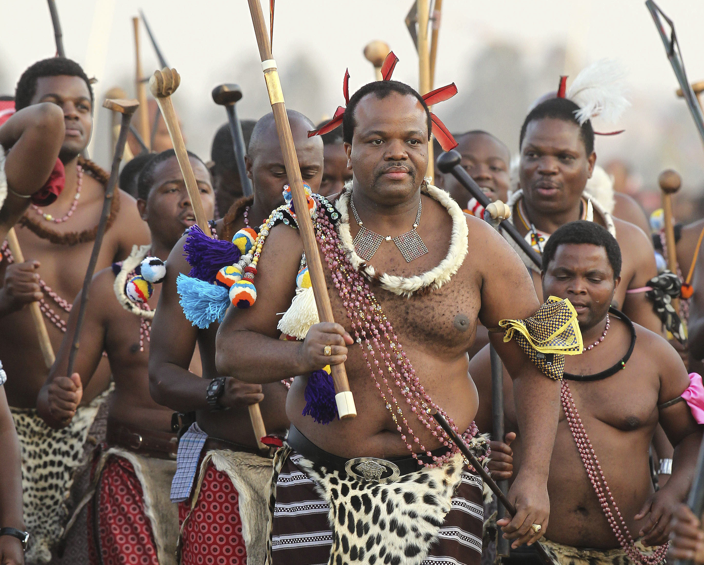 FILE - Eswatini's King Mswati III, center, dances during a Reed Dance in Mbabane, Swaziland, on Sept. 3, 2012. The small southern African nation of Eswatini was holding elections Friday Sept. 29, 2023 to decide part of the makeup of its parliament, even as the extremely wealthy king retains absolute power, political parties are banned and elected representatives can merely advise a monarch whose family has reigned supreme for 55 years. (AP Photo/Themba Hadebe, File)