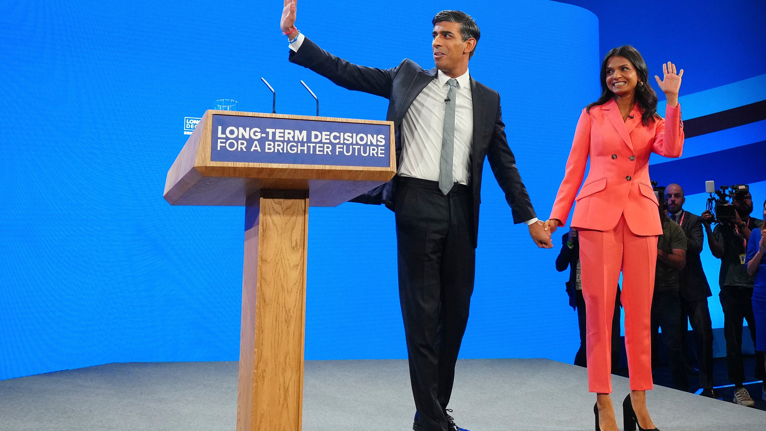 British Prime Minister Rishi Sunak and wife Akshata Murty wave after his speech at the Conservative Party annual conference at Manchester Central convention complex in Manchester, England, Wednesday, Oct. 4, 2023. (AP Photo/Jon Super)