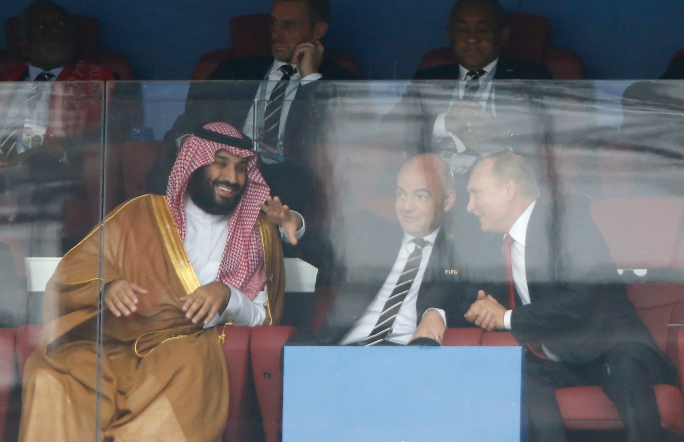 FILE - Saudi Arabia Crown Prince Mohammed bin Salman, left, FIFA President Gianni Infantino, center, and Russian President Vladimir Putin watch the match between Russia and Saudi Arabia which opens the 2018 soccer World Cup at the Luzhniki stadium in Moscow, Russia, on June 14, 2018. If Saudi Arabia could have designed a process for choosing future World Cup hosts, it might look similar to what FIFA unveiled for the 2030 and 2034 men’s soccer tournaments. The Saudi Arabian soccer federation became the favored candidate to host in 2034. (AP Photo/Hassan Ammar, File)