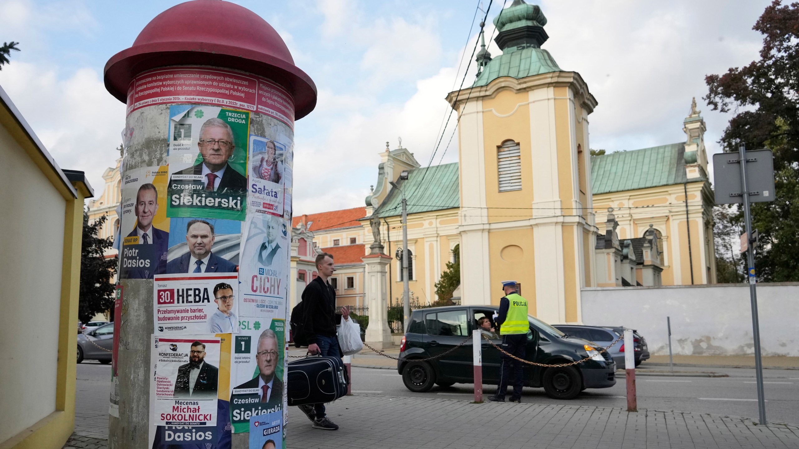 Campaign posters of various candidates running Sunday in Poland's crucial parliamentary elections are displayed in Sandomierz, Poland, Friday, Oct. 13, 2023. At stake in the vote are the health of the nation's democracy, strained under the ruling conservative Law and Justice party, and the foreign alliances of a country on NATO's eastern flank that has been a crucial ally. The main challenger is centrist Civic Coalition.(AP Photo/Czarek Sokolowski)