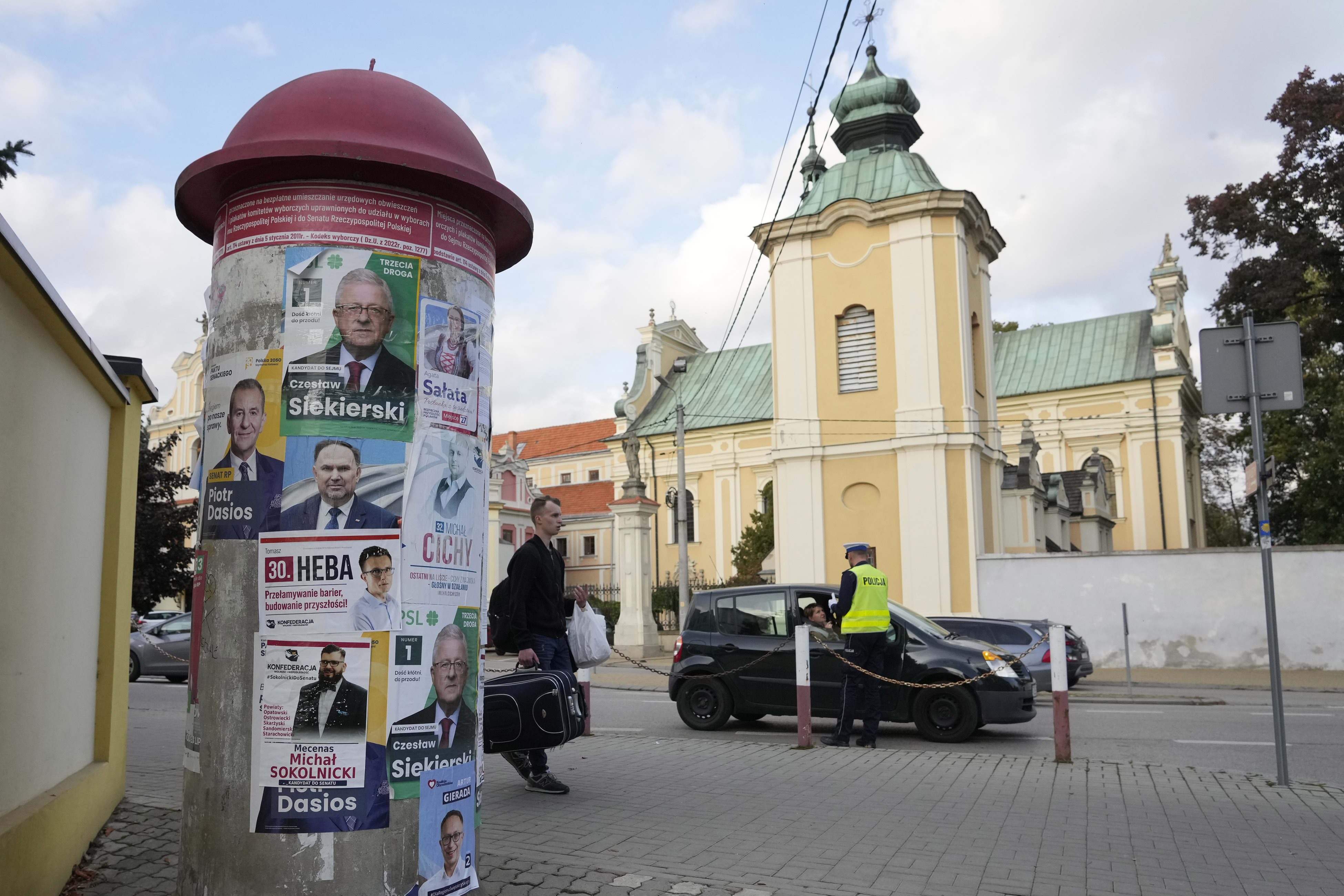 Campaign posters of various candidates running Sunday in Poland's crucial parliamentary elections are displayed in Sandomierz, Poland, Friday, Oct. 13, 2023. At stake in the vote are the health of the nation's democracy, strained under the ruling conservative Law and Justice party, and the foreign alliances of a country on NATO's eastern flank that has been a crucial ally. The main challenger is centrist Civic Coalition.(AP Photo/Czarek Sokolowski)