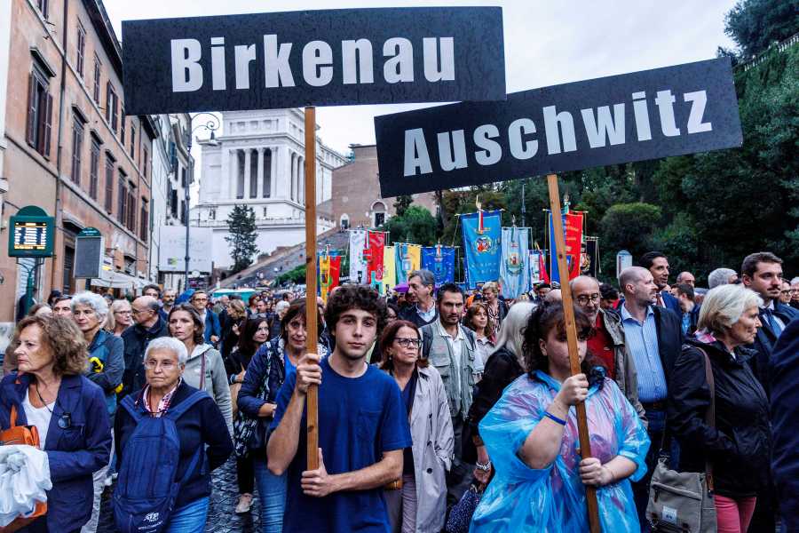 People participate in a march of remembrance marking the 80th anniversary of the roundup of the Jews of Rome in Rome, Italy, Monday Oct. 16, 2023. Italian lawmakers on Monday marked the 80th anniversary of the Nazi roundup of more than 1,200 Roman Jews in the Holocaust with a debate on a measure to partially fund a long-delayed Holocaust Museum in the capital. (Roberto Monaldo/LaPresse via AP)