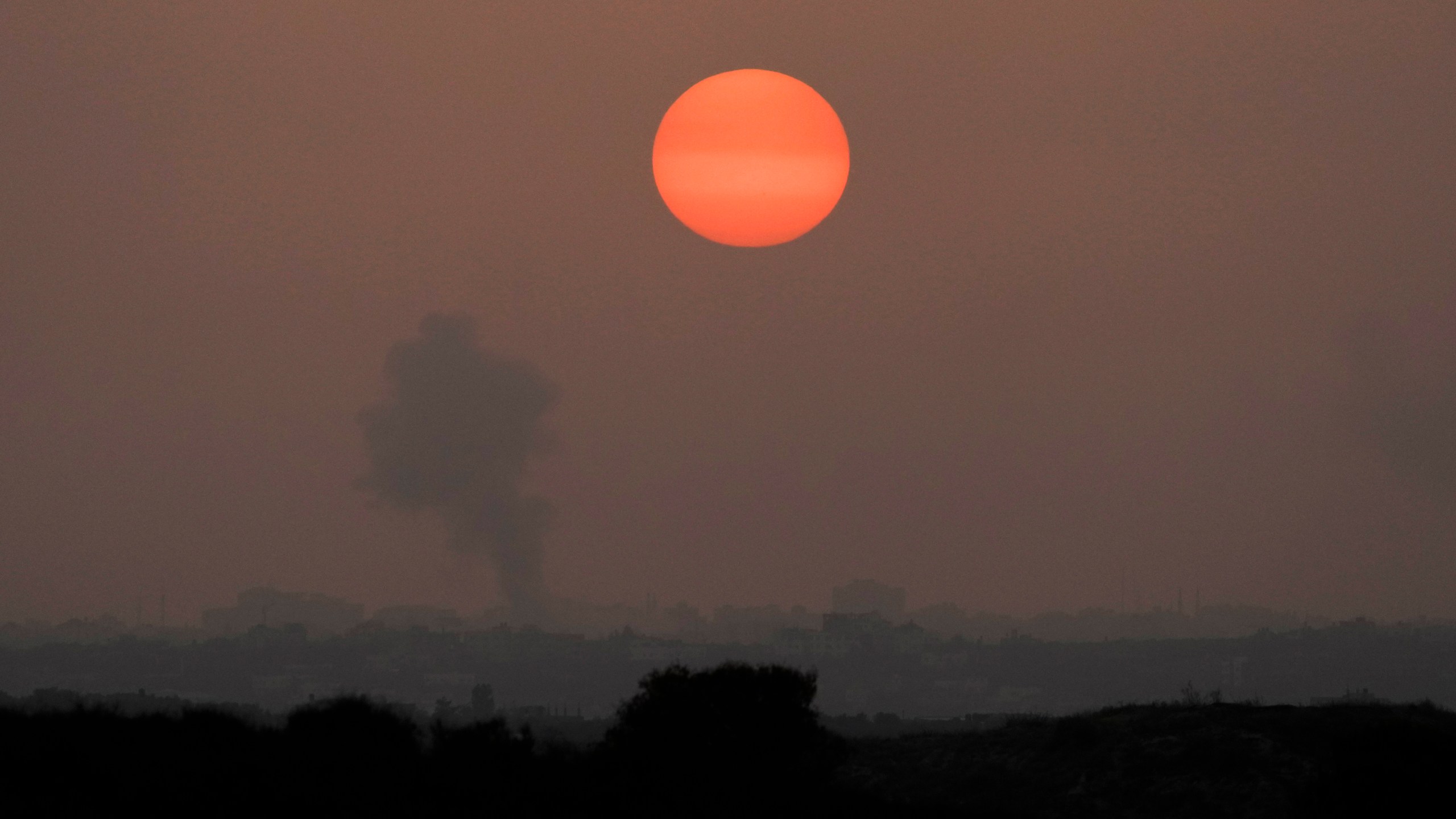 Smoke rises following an Israeli airstrike in the Gaza Strip, as seen from southern Israel, Monday, Oct. 23, 2023. (AP Photo/Francisco Seco)