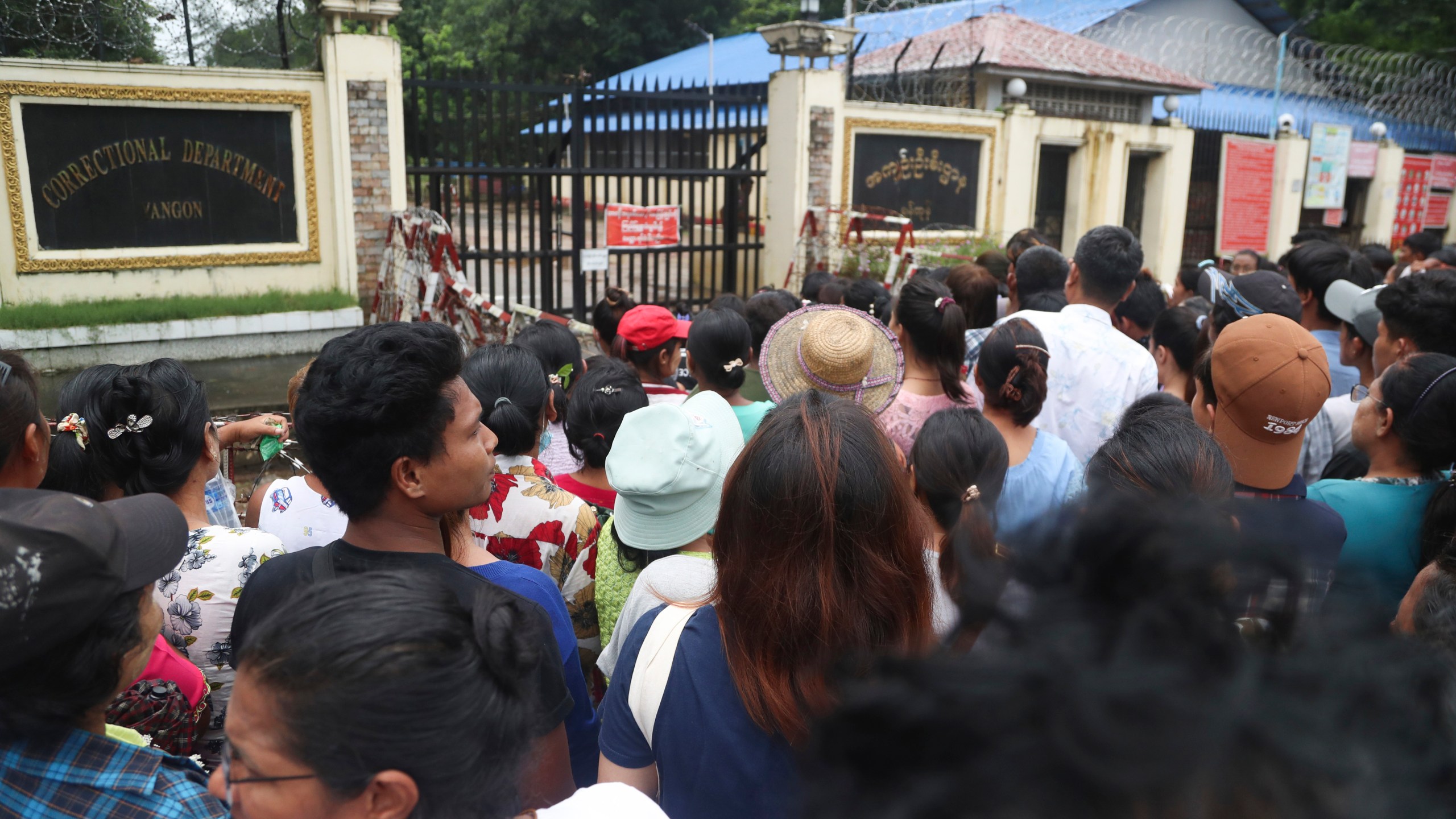 File - Family members and colleagues wait to welcome released prisoners from Insein Prison in Yangon, Myanmar Tuesday, Aug. 1, 2023. Military-ruled Myanmar on Tuesday, Oct. 24, 2023, allowed prisoners to have visitors from outside, a right that had been suspended for 3 1/2 years due to the coronavirus pandemic, the military's information office and prison officials said. (AP Photo/Thein Zaw)