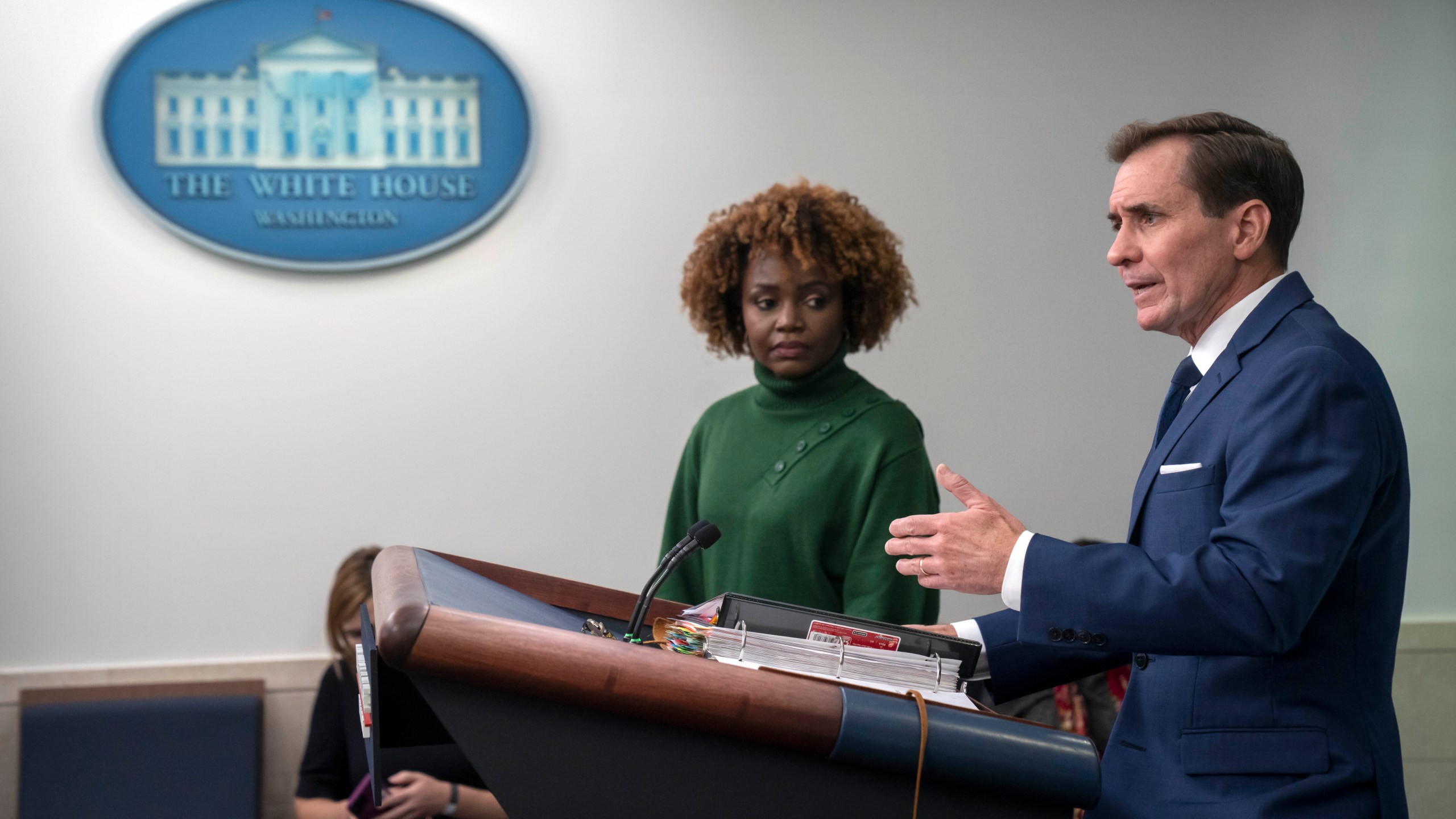 White House press secretary Karine Jean-Pierre, left, listens as National Security Council spokesman John Kirby, right, speaks Tuesday, Oct. 24, 2023, during a briefing at the White House in Washington. (AP Photo/Mark Schiefelbein)