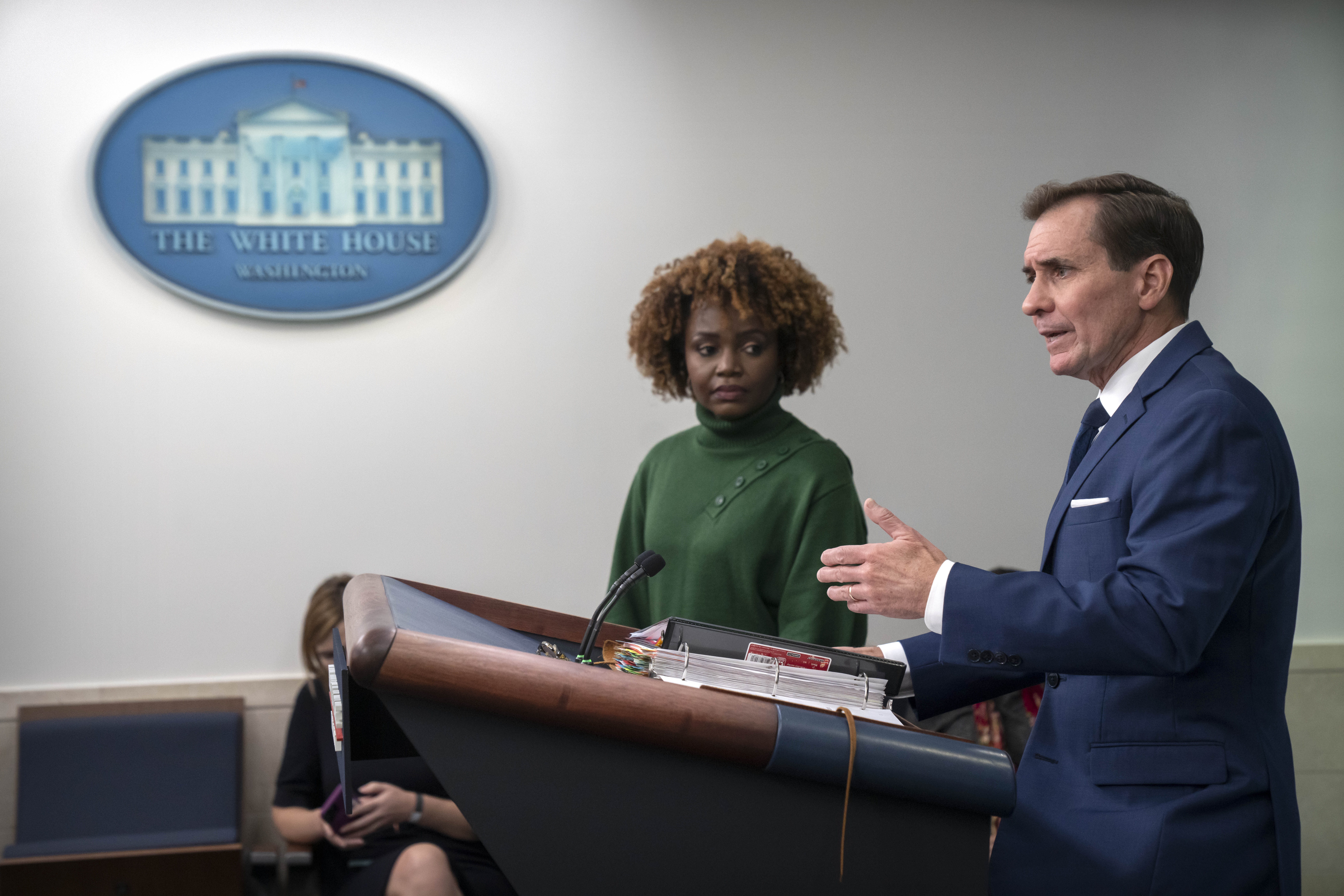 White House press secretary Karine Jean-Pierre, left, listens as National Security Council spokesman John Kirby, right, speaks Tuesday, Oct. 24, 2023, during a briefing at the White House in Washington. (AP Photo/Mark Schiefelbein)