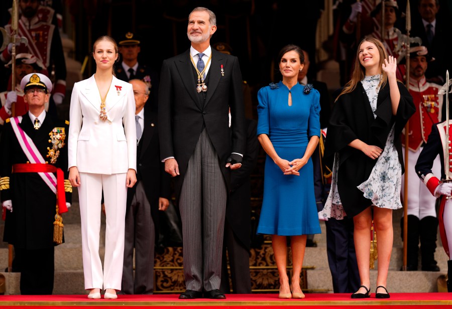 Princess Leonor, left, next to Spanish King Felipe VI, Queen Letizia and her sister Sofia, right, attend a military parade after swearing allegiance to the Constitution during a gala event that makes her eligible to be queen one day, in Madrid on Tuesday, Oct. 31 2023. The heir to the Spanish throne, Princess Leonor, has sworn allegiance to the Constitution on her 18th birthday. Tuesday's gala event paves the way to her becoming queen when the time comes. Leonor is the eldest daughter of King Felipe and Queen Letizia. (AP Photo/Manu Fernandez)